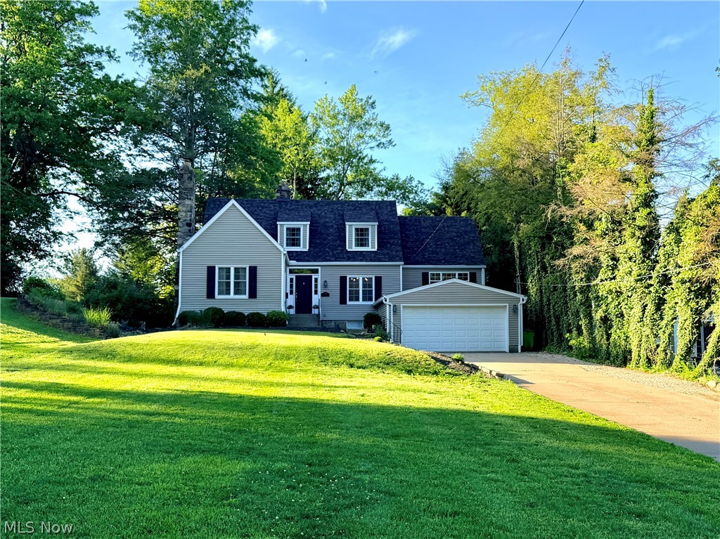 Welcome to this beautifully spacious, updated 4 bedroom, 2.5 bath home in the heart of Mogadore! You will be drawn in by its quaint exterior nestled on nearly half an acre private lot with plenty of space to relax, entertain, and enjoy. From the moment you walk in, you will appreciate the refinished hardwood floors, neutral décor, and inviting layout designed for everyday living and entertaining. The spacious living room features a lovely fireplace that creates a warm, welcoming atmosphere and offers flexibility to be used as a main floor 4th bedroom if desired. The updated kitchen offers granite countertops, ample cabinetry, and flows seamlessly into the dining room and living spaces. Just beyond, the family room boasts stunning vaulted ceilings, abundant natural light, and French doors leading to the private backyard retreat. The oversized primary suite is truly impressive with a huge walk-in closet and ensuite bath featuring dual vanities and updates completed in 2018. The partially finished walk out basement offers multiple flexible living areas including a secondary family room, office or hobby space, laundry, workshop/storage area, and a finished bonus room currently used as a guest space. There are numerous possibilities for today’s lifestyle needs. Major updates provide peace of mind including furnace and A/C 2026, roof 2025, new tankless hot water tank, new mini split system, newer windows, and updated siding. If the outdoors is your thing, step out and enjoy the large deck, fire pit, huge shed, and spacious private backyard perfect for gatherings and outdoor enjoyment. This move in ready home offers multiple levels of living space designed for comfort, entertaining, seamless functionality and making memories for years to come. A home warranty is included for added peace of mind. Do not miss your opportunity to see this one of a kind Mogadore home!
