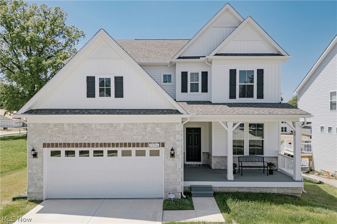 Welcome to 7796 Clydesdale Dr, a recently completed contemporary colonial with custom upgrades and refined finishes throughout. Lightly lived in, this home offers the appeal of new construction with thoughtful enhancements. A welcoming front porch opens into a bright foyer. The foyer flows into a formal dining room featuring wainscoting, a tray ceiling, and LVP flooring that continues through the main living areas. At the back of the home, the layout opens into a spacious living room and kitchen designed for everyday living and entertaining.The kitchen features a large center island with breakfast bar seating, quartz countertops, a tile backsplash, and stainless steel appliances. A walk-in pantry connects the kitchen to the dining room. Just off the kitchen, a dining area includes sliding door access to the back deck. The living room offers a comfortable gathering space centered around a fireplace. A nearby flex room can serve as a bedroom or office. A half bath and mudroom complete the first floor. Upstairs, a loft provides additional living space. The second floor includes four bedrooms with neutral finishes. The primary suite features a tray ceiling, two walk-in closets, and an ensuite bath. A bonus room off the suite adds flexibility. A second full bath and laundry room complete the level. The full walk-out basement offers excellent potential for finishing and includes plumbing for a future bath. Schedule your tour today!