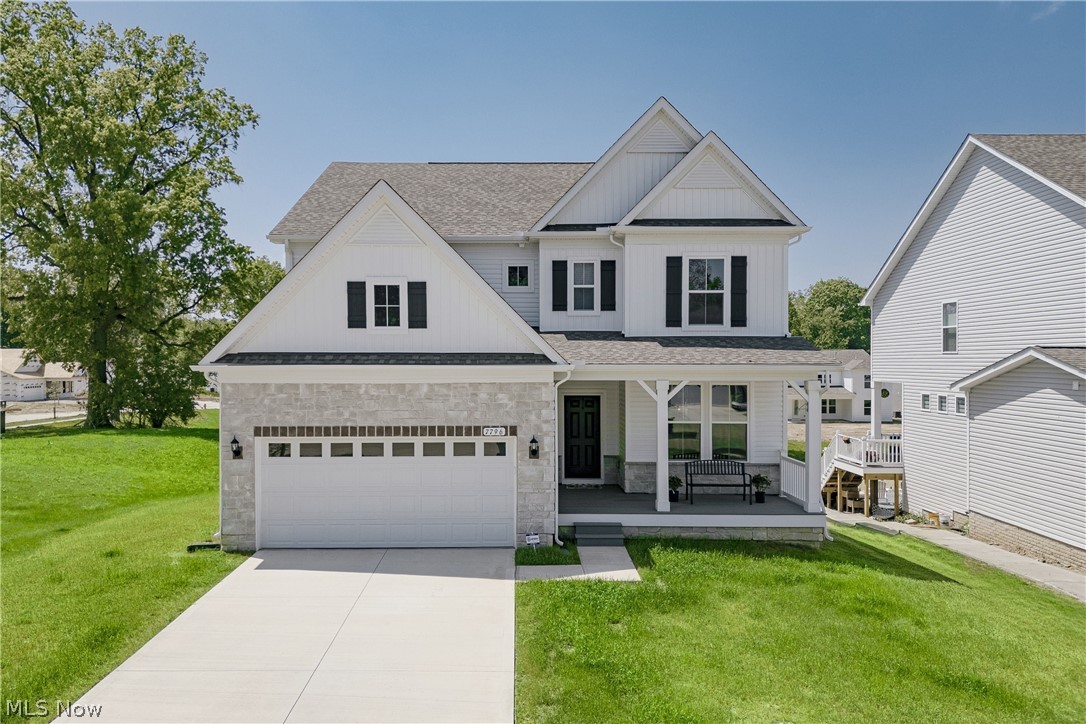 Welcome to 7796 Clydesdale Dr, a recently completed contemporary colonial with custom upgrades and refined finishes throughout. Lightly lived in, this home offers the appeal of new construction with thoughtful enhancements. A welcoming front porch opens into a bright foyer. The foyer flows into a formal dining room featuring wainscoting, a tray ceiling, and LVP flooring that continues through the main living areas. At the back of the home, the layout opens into a spacious living room and kitchen designed for everyday living and entertaining.The kitchen features a large center island with breakfast bar seating, quartz countertops, a tile backsplash, and stainless steel appliances. A walk-in pantry connects the kitchen to the dining room. Just off the kitchen, a dining area includes sliding door access to the back deck. The living room offers a comfortable gathering space centered around a fireplace. A nearby flex room can serve as a bedroom or office. A half bath and mudroom complete the first floor. Upstairs, a loft provides additional living space. The second floor includes four bedrooms with neutral finishes. The primary suite features a tray ceiling, two walk-in closets, and an ensuite bath. A bonus room off the suite adds flexibility. A second full bath and laundry room complete the level. The full walk-out basement offers excellent potential for finishing and includes plumbing for a future bath. Schedule your tour today!