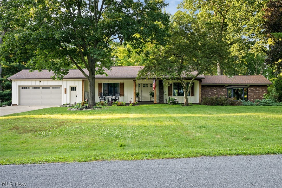 Welcome home to this stunning lake-front property! The perfect oasis awaits you with this beautifully updated water-front property situated on 2.95 scenic acres, offering the perfect blend of comfort, character, and peaceful surroundings. Features include a stunning remodeled kitchen with thoughtful updates, including quartz counters, LifeProof flooring, Choice cabinetry, and new kitchen appliances including: a 3-rack dishwasher, fridge w/ refillable water pitcher, a stove with multiple cooking options, and a newly installed Samsung range hood - serving as a statement piece with extra ventilation. The neutral color scheme flows seamlessly into the inviting main living area, showcasing vaulted ceilings, wood beams, and a gas fireplace the perfect spot to cozy up to after a long day on the water in the summertime. The spacious first-floor primary bedroom adds convenience with nearby laundry hookups. Enjoy the serene setting with the rear deck and screened rear porch, giving the perfect view of the wooded back yard and lake. The walk-out basement is perfect for entertaining guests. Additional upgrades include: laundry on two levels, a mini split in the primary bedroom, Trex front porch, new radon mitigation system, water filtration and softening upgrades (2025), a Well Rite well pressure tank, twin-tank water softener, catalytic carbon filter, Viqua UV light, and AC Unit (2024). The private-lake setting is hard to beat, with lake access and a peninsula, surrounded by peaceful nature views that create a scenic backdrop. The private lake setting offers access for fishing and kayaking, with a quiet neighborhood ideal for walking while still close to shopping, schools, and amenities. The oversized 2 car garage includes nature stone flooring for easy maintenance and a clean finish. Whether you're looking for a primary residence or a getaway-style retreat, rare water-front properties like this one don't come up often! Don't miss your chance to make this one yours.