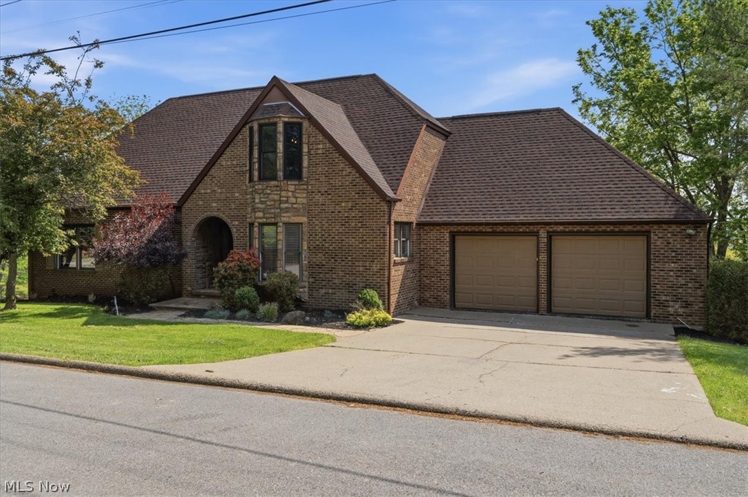 Discover 75 Oakridge Drive in Woodland Park, one of Parkersburg's most desirable neighborhoods. This delightful brick home features three bedrooms and three and a half baths, making it a must see. Upon entering, you'll be welcomed by vaulted ceilings in the foyer and living room that are lit up with an abundance of natural light. Off the kitchen is a spacious eat in kitchen, complete with granite counter tops that flows right into your dining room. The first floor also includes a master bedroom with a private full bath featuring a walk-in shower, a convenient half bath, and a large home office/study. Upstairs, you'll find two additional bedrooms, one recently updated with stunning epoxy floors and a unique castle like design, along with another full bathroom. The walk-out basement offers a generous 29x15 recreation room, a built-in wet bar, a laundry room, and a newly renovated gym or workshop area to suit your needs. Extra features of this home include a two-story deck, freshly done epoxy garage floors, a new roof installed in 2025, and a central vacuum system. This home is a true gem in a fantastic north end neighborhood waiting for new ownership!