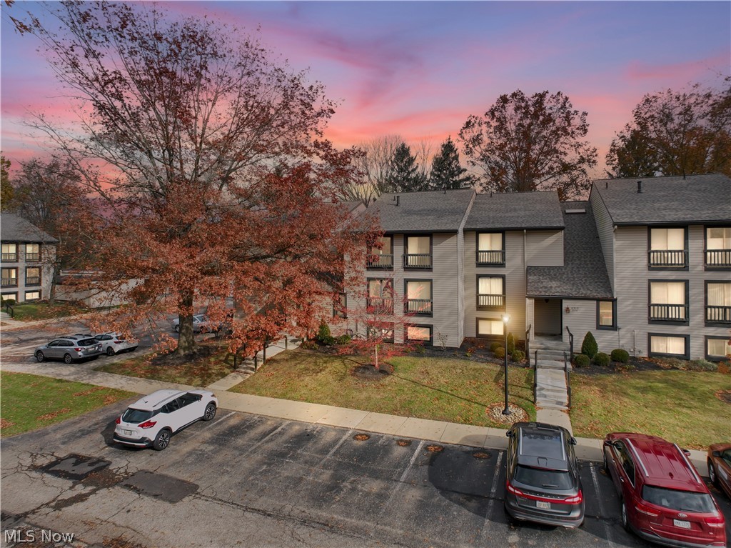 Welcome home to carefree living in the highly desirable Greenwood Village community. This beautiful condo offers comfort, convenience, and resort style amenities, all tucked into one of the most picturesque neighborhoods in Northeast Ohio.

Step inside to an open and airy living space filled with natural light. The spacious living room flows seamlessly into the dining area and out onto a private covered balcony, perfect for morning coffee or winding down in the evening. The striking accent wall brings personality and warmth, creating a stylish space for entertaining or relaxing.

The kitchen features timeless white cabinetry, an abundance of storage, and plenty of counter space for cooking or hosting. Down the hall, the oversized primary bedroom provides a peaceful retreat with room for a sitting area and a walk-in closet offering incredible storage. Two full bathrooms add convenience and flexibility, with one featuring a tub and shower and the other offering a vanity and linen storage.

Enjoy resort level community amenities, including the stunning indoor swimming pool, outdoor pool, fitness center, hiking trails, clubhouse, playground, and more. All lawn care, snow removal, and exterior maintenance are handled for you, making this the perfect option for a low maintenance lifestyle without sacrificing comfort or enjoyment.

Whether you are looking to simplify life, invest, or settle into a quiet and scenic setting close to restaurants, shopping, and Cuyahoga Valley National Park, this condo checks all the boxes. Come experience the beauty and community of Greenwood Village for yourself.