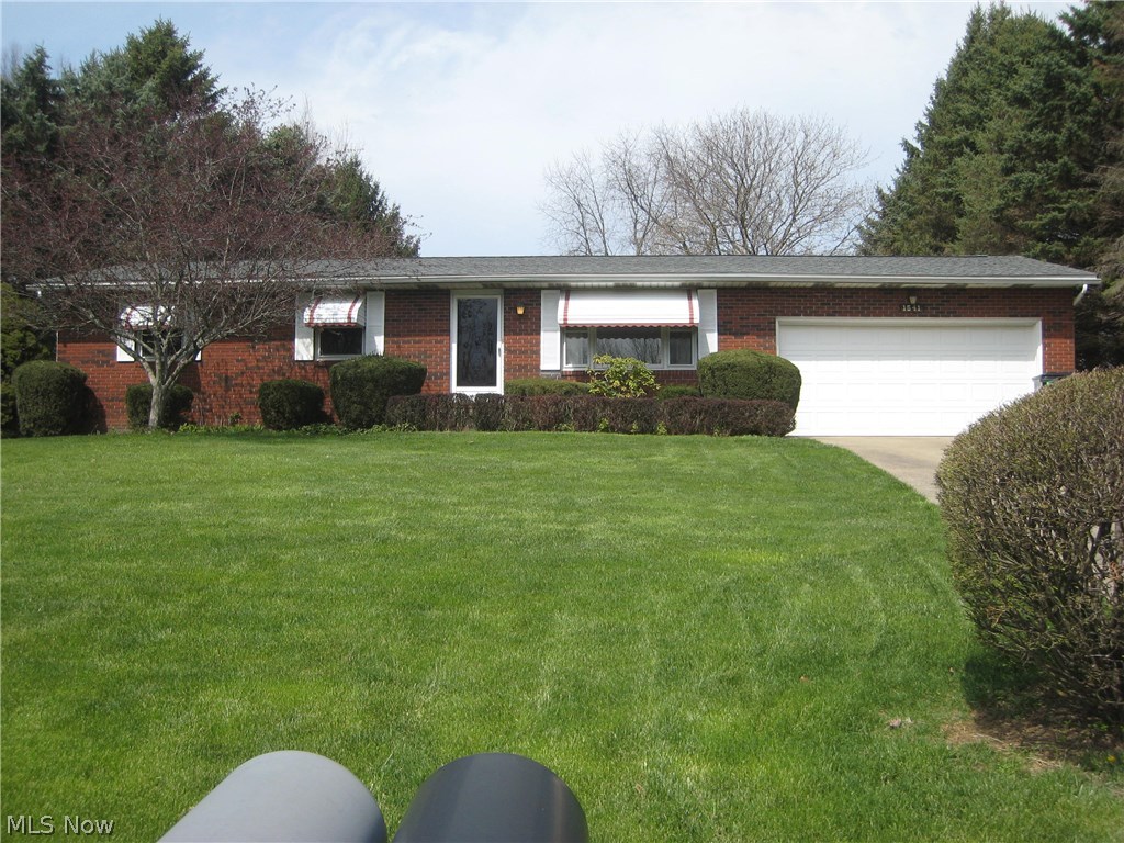 Custom built and meticulously maintained ranch located 5 minutes from 77,  schools and the amenities of the thriving community of Green.  The many updates of this home include pergo wood flooring, roof, upgraded electric, radon mitigation system and insulated steel front door. The open kitchen/dining room is great for entertaining and walks out to the 3 season porch overlooking the private yard. The 3 bedrooms offer plenty of closet space,  and the master bedroom will accommodate your king size furniture. The lower level rec room adds an additional 516 sq.ft. of living area and features a bar and another full bath.  Lots of built in shelving for storage and a workbench, too.  All appliances stay including the washer and dryer.