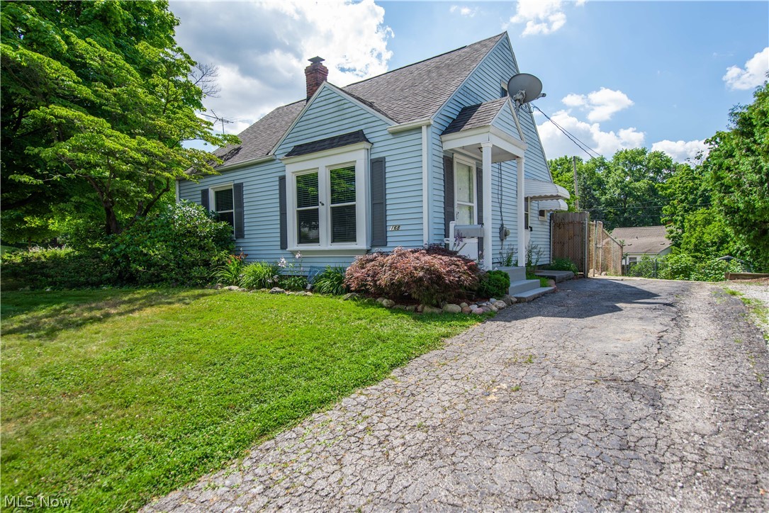 WELCOME TO 168 E ROSEWOOD AVE IN THE HEART OF FIRESTONE PARK.
This charming Cape Cod style home with charming curb appeal has 3 Bedrooms and 1.5 Bathrooms. Once you step through the front door, the house boasts rich honey colored (freshly refinished) - original solid oak hardwood floors, the desirable silver leaf grey interior wall color, and bright white trim and baseboards  offer the perfect backdrop for your new freshly painted - move in ready home. There are 2 bright bedrooms and full bathroom along with the kitchen on the first floor. The first-floor good sized bedrooms are also the amazing fresh silver leaf gray, trimmed in bright white  with the solid hardwood floors. The back bedroom on the first floor has an entry door to the fenced in - small deck, patio, and wonderfully landscaped backyard. The full bathroom has brushed nickel faucet and hardware, white fixtures, white tile bathtub surround and neutral beige ceramic floor tile. Finishing the first floor is the beautiful bri