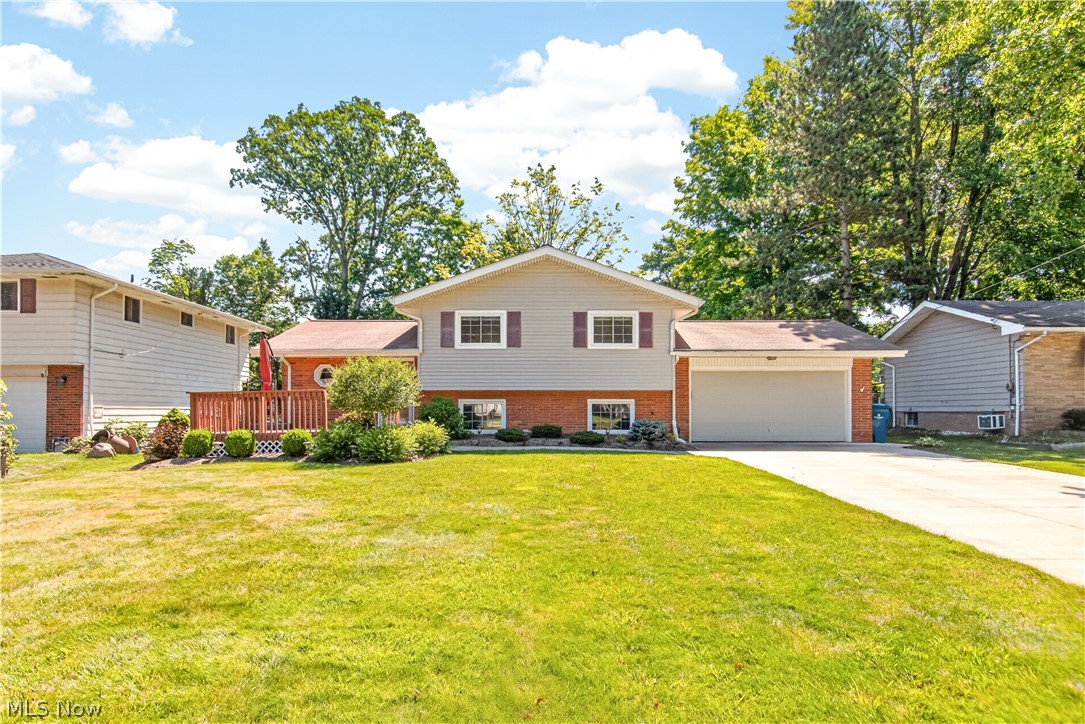 Welcome home to this beautifully maintained split-level in the heart of North Olmsted! Thoughtfully updated and move-in ready, this 3-bedroom, 1.5-bath home blends timeless character with modern improvements. The inviting living room features soaring ceilings with exposed wood beams, creating a warm, open feel that flows effortlessly into the dining area and kitchen. Sliding doors lead to a spacious deck overlooking the expansive backyard—an ideal setting for morning coffee, summer cookouts, or simply relaxing while taking in the neighborhood. The newer hot tub offers the perfect place to unwind year-round, even on snowy winter evenings. Major updates provide peace of mind, including the boiler, central air, hot water tank, driveway, walkways, and patio, all completed in 2020. A newer storage shed adds even more convenience for tools, lawn equipment, or seasonal storage. Set in an established neighborhood known for its friendly atmosphere, this home offers the perfect combination of comfortable living, outdoor enjoyment, and convenient access to shopping, dining, parks, and highways. Don't miss your opportunity to make this North Olmsted gem your own!