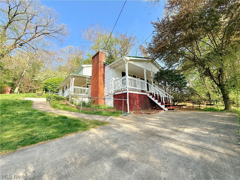 Back on the market! No fault of the Home! Own your own little acre of paradise with this 3 bedroom, 2 bath Belpre home. Tucked on a quiet wooded lot, this property offers the peaceful setting you have been craving while still being just minutes from town, State Route 7, and the West Virginia border. A detached garage, large workshop, extra parking, and an additional outbuilding provide all the space you need for hobbies, storage, and everyday convenience. You will also appreciate the metal roof along with an updated HVAC system and hot water tank for added peace of mind. Priced to sell and ready for your personal touch, this is an opportunity you do not want to miss. Tour it quickly before it is gone.