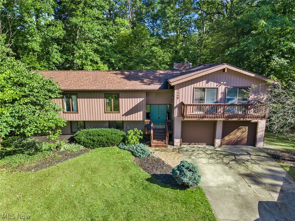 This home is a must see!! Dont miss this wooded oasis convenient to everything! Desirable end of the cul de sac location with a spacious and private  lot. Walk into the main level of the home and enjoy vaulted ceilings throughout.  Upon entry you'll find  a welcoming foyer, leading to a spacious living room with dual sliders to a sunny deck.  From there you'll find a large formal dining room that leads to a spacious eat in kitchen with island.  Vaulted ceilings connect the space to a welcoming and cozy family room with a gas fireplace and sliders to the serene and private back deck. Down the hall on the mail level is the spacious owners suite with walk in closet and en suite full bathroom. The main level is completed with an an additional 2 large bedrooms with excellent closet space and an additional full bath with large walk in shower. The walk out lower level offers an exceptional additional 2 large bedrooms, a full bath, and a SECOND family room with fireplace and sliders out to a b