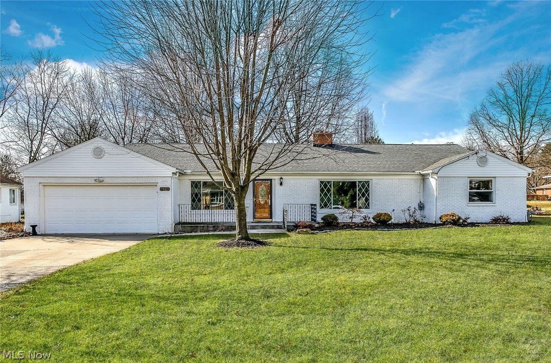 Solid brick ranch with over 2,500 square feet of living space including a charming finished lower level! Gorgeous living room with a traditional fireplace and large picture window. Spacious formal dining room. Big bright kitchen has plenty of cabinets, granite counter tops, all appliances and room for your informal eating area. Rich paneling in the first floor family room which opens to the newer deck and nice back yard. Nice master with private master bath. Very cool finished lower level with a Tudor Stonehedge decor includes a second fireplace and bar. Beautifully maintained and updated throughout.
