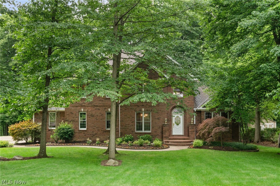 Welcome to 189 Ballantrae Drive: the epitome of pride-of-ownership, craftsmanship, and quiet wooded location. A true gem, this home was built by Emerald Custom Builders, was professionally decorated, offers over 4,300 sqft of finished living space, and has a spacious 3-car garage. Choose between 2 master suites: either upstairs, or enjoy the convenience of the first-floor master suite. Single-floor living continues with the first-floor laundry room with reverse osmosis system. The roof is a 50-year shingle; upstairs carpet June 2026; some rooms freshly painted June 2026; updated 2026 wet bar in basement with beer taps; 2026 freshly stained railings and posts on back deck; updated 2026 full-bathroom in basement; oven 2024. The HVAC system is cleaned 2x year.  Both fireplaces are wood-burning and currently have vent-free gas logs. The walk-out basement offers something for everyone: work out room; billiards area with custom fish tanks; living room with fireplace; wet bar with oven, sink, taps, wine refrigerator; full-bathroom; ample storage. Other features include: upstairs loft; 2-story great room; first-floor office with built-in book shelves; power sky lights; chandelier with winch to lower/raise which allows for easy cleaning; alarm system; outdoor sprinkler system; landscape lighting; central vacuum. This luxury home is a must-see. Call today for your private showing.