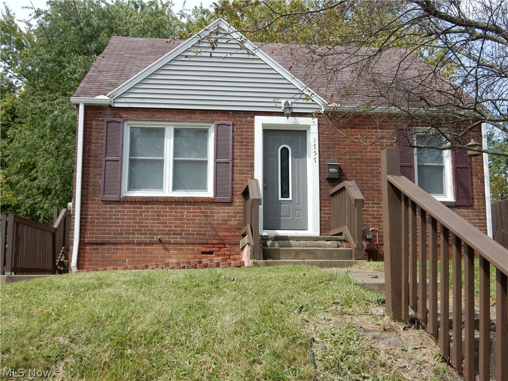 Cute, cute, cute! This adorable, tastefully updated and move-in ready all brick bungalow is perfect for the first time home buyer or the down-sizer. Seller's have done it all for you, just pack your things and move in. You will appreciate the many updates. Electric updated (2008) with 100 amp service. Kitchen with updated flooring, counters and cupboards. Living room with fresh paint (Aug. 2017) and laminate flooring. All bedrooms offer ample closet space with the upstairs bedroom having a bonus area. Beautifully updated bathroom with tile shower surround and a dual head shower. No need to purchase appliances, the range, refrigerator, washer and dryer remain with the home.  All windows have been updated as well, and sellers are leaving the two window a/c units. The large 25'x23' basement offers plenty of storage space and has glassblock windows. Outside, you will find all wood areas have a been freshly painted and the large back yard is fenced. The new curtains, mini blinds, rugs and s