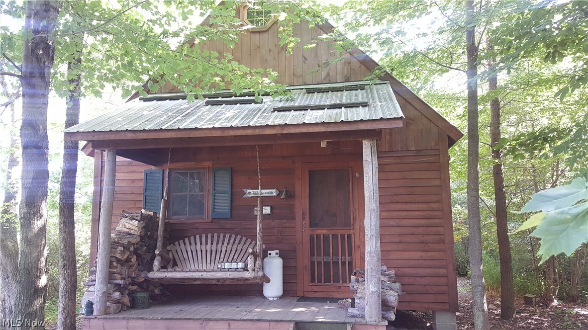 This property is a hunting or get away cabin the time and quality put into this retreat will amaze you- all furniture and built ins currently at the property will stay - including the bunk beds, ladder and remaining furniture - it has no running water or septic - it is quiet beautiful and rustic. If getting away is your goal call on this - Kitchen and interior is very "Log Cabin" but with an open spacious feel.
