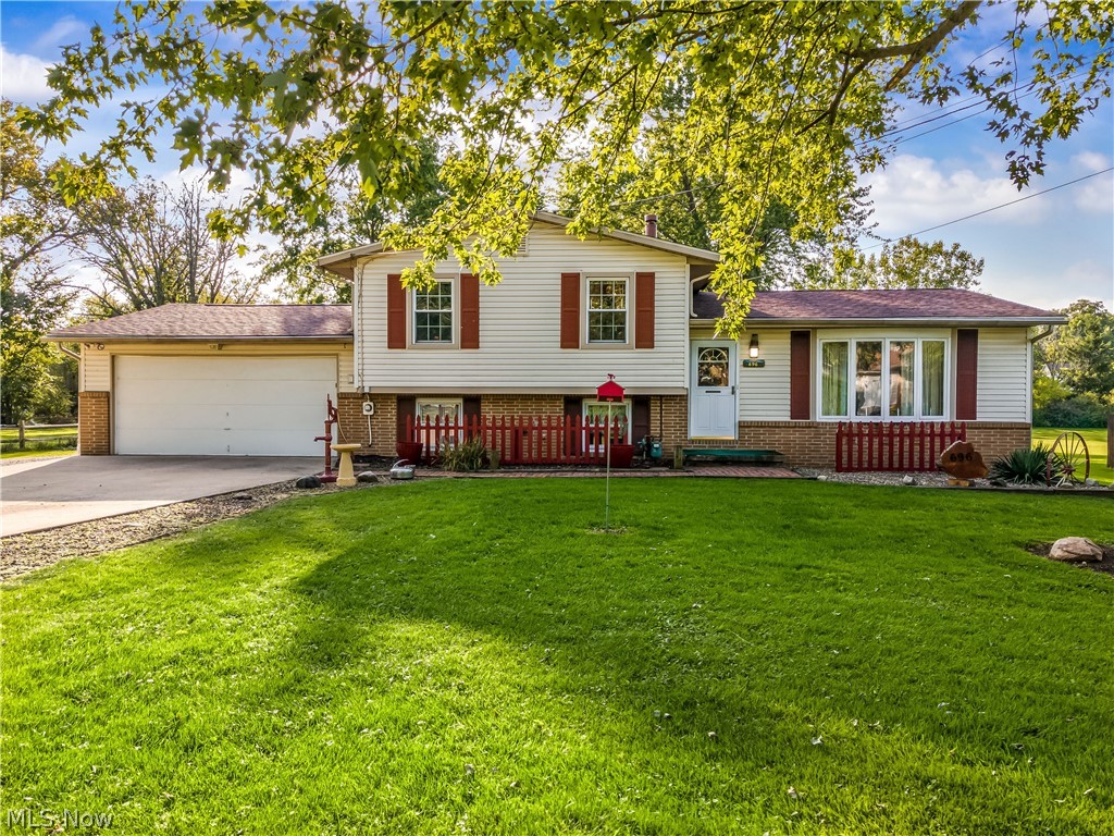 Welcome to this stunning split level located on a fabulous lot in Springfield Township.  This inviting abode offers 3 bedrooms and 2 full baths.  There is a large living room at the front of the home that offers tons of natural light.  There is a spacious eat-in kitchen which offers ample cabinet and counter space.  Don't forget the sunroom off the eat-in kitchen.  Enjoy chilly fall evenings in the family room with a wood burning fireplace.  All of the bedrooms are situated on the second level.  All of this plus a 2 car attached garage and an additional 3 car detached garage with a carport for the car enthusiast. The lot is flat, just under a full acre and has mature trees.  This home is absolutely move in ready and awaiting a new owner.  Fabulous home and a great location.  Call to schedule a showing today!!