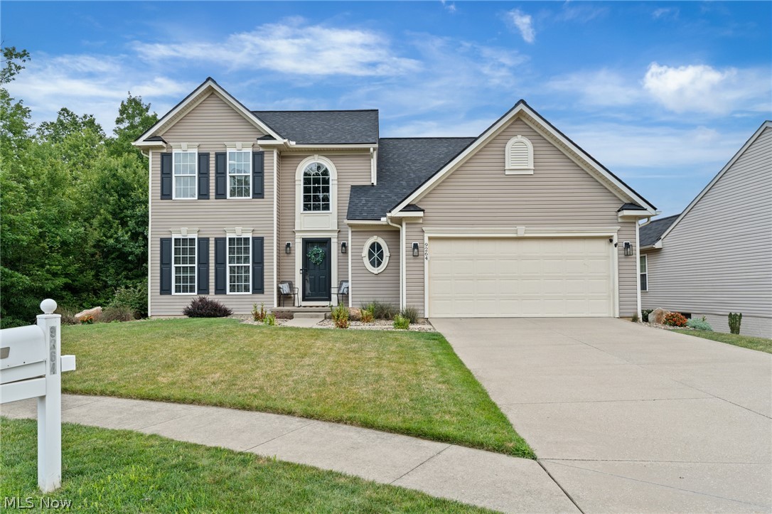 Welcome home to this beautifully updated, move-in ready colonial in Lake Twp and North Canton CSD! Tucked away on a quiet cul-de-sac in the Highland Creek neighborhood, this 3-bedroom, 2.5-bath home offers over 3,500 square feet of finished living space, access to community walking paths and a scenic neighborhood pond, all while being just minutes from I-77 for an easy commute. Step inside to a bright two-story foyer and discover new engineered hardwood flooring throughout the main level, fresh interior paint, and all-new lighting that create a clean, modern feel. The beautifully refreshed kitchen features newly painted cabinetry, quartz countertops, and all new stainless steel appliances, opening to the impressive vaulted great room with a floor-to-ceiling stone fireplace. A banister overlooks the great room from the second floor, adding to the home's open and airy design. The first-floor primary suite offers tray ceilings, a spacious walk-in closet, and a private bath with dual vanities, a garden tub, and separate shower. First-floor laundry adds everyday convenience. Upstairs you'll find two generously sized bedrooms, a full bath, and a versatile loft that's perfect for a home office, reading nook, or play area. The finished lower level provides even more living space, ideal for a rec room, home gym, or media room. Outside, enjoy the fenced backyard with a raised Trex composite deck leading down to a paver patio, plus the added privacy of a permanent wooded area beside the home that cannot be developed. Other updates  include a new 30-year roof (2024) and new water heater (2024). With thoughtful updates, a functional layout, and an unbeatable location, this home checks all the boxes. Call today to schedule your private showing!