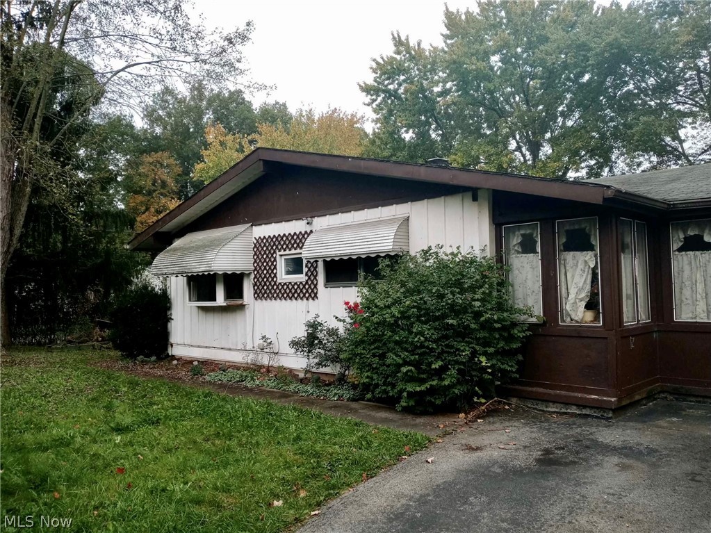 Affordable 3 bedroom, 1.5 bath ranch-style home on a large lot with attached garage.