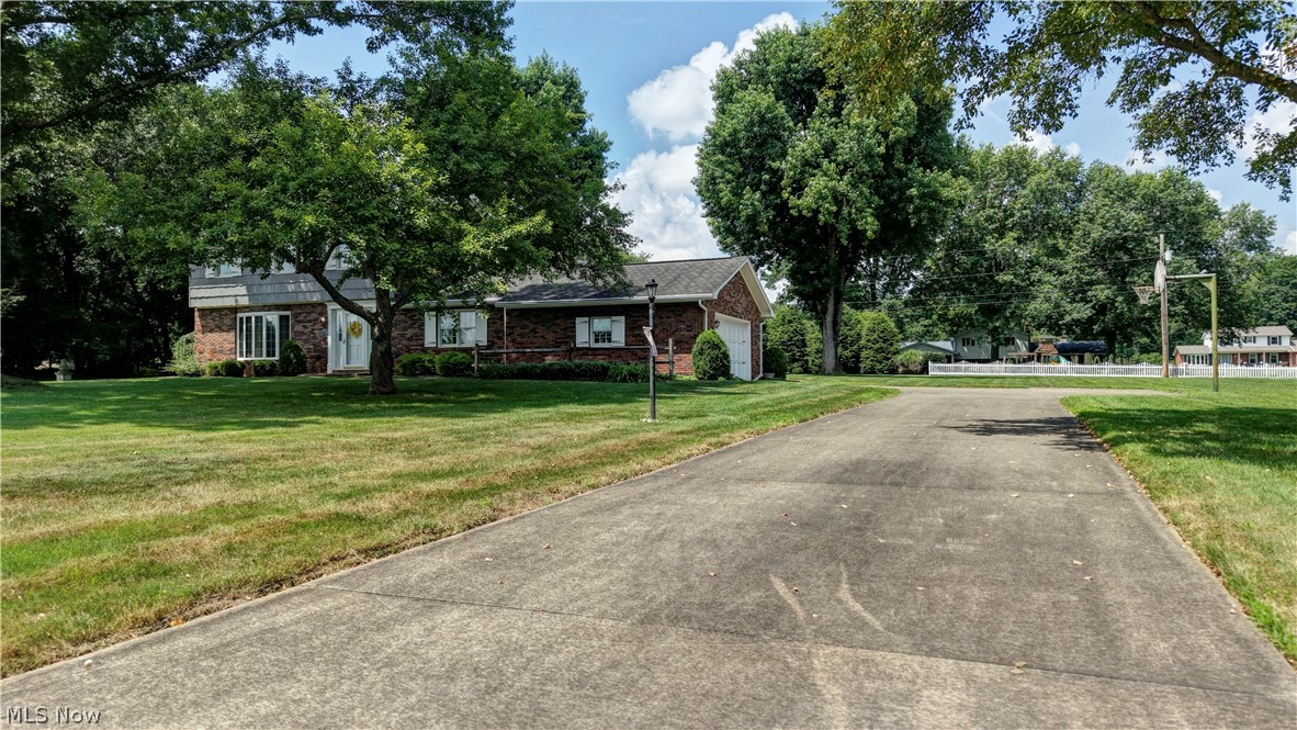 Discover the perfect home you have been searching for.  From the moment you arrive you will be greeted with the welcoming curb appeal with brick and cedar construction.  The same owner since 1978 who have meticulously taken care of this home and have created lasting memories with their family.  As you enter the front you are greeted by the beautiful foyer.  On the main level is the formal living room with bay window and dining room complete with custom oak and cherry trim throughout the home.  A large inviting family room with built-in bookshelves, patio sliding doors and wood fireplace.  Remodeled and extended kitchen with cherry cabinets and new flooring.  Included are the appliances, refrigerator, double oven, microwave and dishwasher.  A laundry room and 1/2 bath complete the main level. The 2nd level has a primary suite and primary bathroom, with his and her closets, recently tiled shower.  Two additional generously sized bedrooms are on the 2nd level.  Finished basement with a den and an office that could be used for an additional bedroom, bar, built-in bookcases and a cedar closet.  Utility room in the basement includes a freezer, screens for windows and a sink.  Reverse osmosis water system.  Anderson replacement windows.  Gutter guard spouting.  HVAC for 2nd floor new in 2026.  Utility averages:  $200.