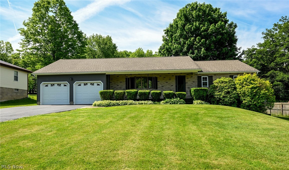 AMAZING!!!  The incredible ranch home you have been waiting for is finally here!  Centered on a perfect 1 acre lot, tucked back from the road while providing a gorgeous tree lined back yard.  A nice long drive with turn around, takes you up to the 2 car attached garage.  Brick faced, vinyl wrapped sides and walk-out basement.  Around the back is a remarkable covered deck!  Plus an extended concrete patio to enjoy the sun!  The huge shed is just a beautiful as the house!  Then still, beautiful walnut and apple trees, a fire pit, play set and tons of space for kids and pets to play, add a huge garden and more!  Now let's get to the spectacular interior!  A nice foyer welcomes you in and opens to the formal living room.  This space has a large window that floods the room with natural light!  Parallel is a wide open family room/dining room with sliders to the deck.  Next is the kitchen, equip with plentiful cabinets, easy maintenance countertops, stainless fridge and range and a cute breakfast nook!  Down the hall is the convenient main floor laundry, a half bathroom, access to the back deck, garage and basement.  At the other end of the home you will find 2 guest bedrooms, the master and full bathroom.  The lower level is a phenomenal opportunity to double your living space!  A wide open area with new glass block windows, a bonus room and walk-out door!  Great updates include a brand new panel box 2026, new tub/shower surround 2025, new well pump 2024, new deck, siding, facia, gutters and garage door opener 2022, new roof, windows and slider 2021!  You couldn't ask for better sellers, they have done all the inspections for you!  CALL TODAY for your chance to make this all yours!