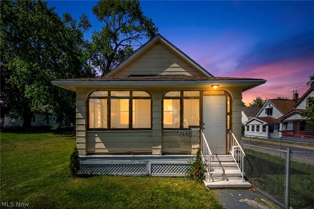 Beautiful "Doll House" that has been remodeled & refreshed for you...is sure to delight! Featuring a bright, airy interior designed w/today's popular colors & finishes, this charming & affordable home offers easy one-floor living in a desirable location within a sought-after zip code. Fully fenced yard is perfect for relaxing, entertaining & pets, featuring chain-link fencing along the front and sides plus a privacy wood fence enclosing the backyard. Private driveway provides convenient off-street parking. Recent peach & berry trees add beauty & enjoyment to the inviting outdoor space. Inside, you'll appreciate the fresh updates throughout, including the removal of all carpeting plus addition of beautiful vinyl & luxury vinyl plank flooring for easy maintenance & modern appeal. New LED lighting & updated fixtures brighten every room & create a warm, welcoming atmosphere. 3 month old furnace/upgraded thermostat provides year-round comfort plus peace of mind. Charming floor plan offers flexibility w/spacious "L"-shaped great room that could serve as a home office, hobby area or potentially be enclosed to create a third bedroom. Current owner thoughtfully enclosed the front porch, adding valuable living and relaxation space to enjoy throughout the seasons. Fantastic kitchen includes updated new appliances, & the convenient laundry room comes complete w/washer and dryer. Refreshed bath to pamper yourself with. New smoke/CO detectors., fixtures, etc. Beautiful, affordable & move-in ready, this delightful home offers comfort, convenience & value all in one package. Don't miss this opportunity to enjoy easy living at its finest!