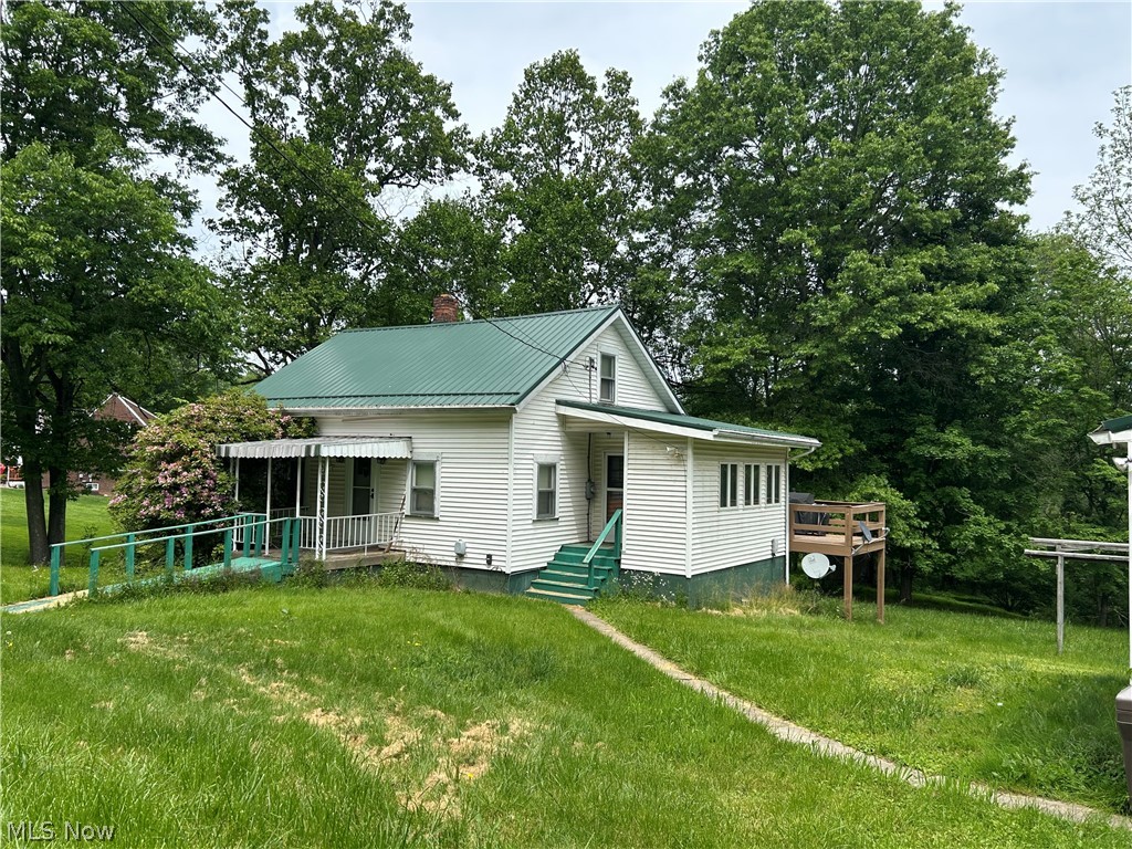 Escape to your own slice of peace and possibility with this unique home setting on 2 acres. Amenities include 1st floor bedroom, dining room, & laundry room plus bonus bedrooms & 1/2 bath on 2nd floor. Perfect for nature lovers, hobbyists, or anyone seeking space and privacy, this property offers it all. Step outside and enjoy room to garden, explore, or simply relax. A standout feature of this property is the dedicated observatory, ideal for stargazing, astrophotography, or quiet nights under the sky. Property  offers 3 garages, large outbuilding, and large deck overlooking acreage. The home is in need of some updates & TLC, making it a great opportunity to add your own style and value.