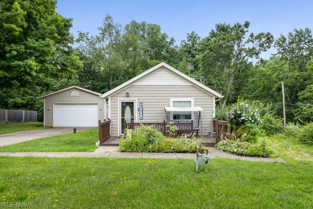 Welcome home to a place where comfort, simplicity, and charm come together. This inviting 3-bedroom, 1-bath ranch is the perfect retreat, offering easy one-floor living in a location that's just minutes from the beauty and recreation of Portage Lakes. Come inside and imagine cozy afternoons curled up by the warm fireplace in the living room, where stories are shared and memories are made. The heart of the home continues into the kitchen, where beautiful wood cabinetry provides timeless character, generous storage, and the perfect backdrop for everything from morning coffee to family dinners. Each of the three bedrooms offers a comfortable space to relax and unwind, while the thoughtfully designed layout makes everyday living both convenient and welcoming. Outside, you'll find even more to appreciate. A detached one-car garage provides additional parking and storage, while the backyard shed offers the perfect place for tools, outdoor equipment, or hobby space. Whether you're gardening, entertaining, or simply enjoying a peaceful evening outdoors, the backyard is ready to become your own private escape. Located just moments from Portage Lakes, you'll enjoy easy access to boating, fishing, waterfront dining, parks, and year-round outdoor adventures. Whether you're searching for your first home, looking to downsize, or simply want to enjoy the charm of ranch living in a desirable location, this home is ready to welcome you.