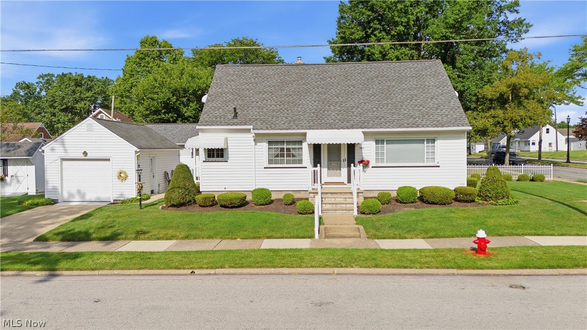 This darling 2 bedroom home faces 18th St. and is ready for its new owners.  This place has been very well taken care of and loved by the previous owners.  There are hardwood floors under the bedroom, hallway and living room carpets.  Windows have been updated and the plush carpet is newer.  This home features lots of windows making it bright and open, large bedrooms and living room to host family and friends.  The kitchen is adorable with beautiful pickled cabinets and drawers.  Upstairs is unfinished but could easily be finished for a 3rd bedroom and office.  Basement is clean and has a shower and laundry area with laundry tub.  Outside this home couldn't be any cuter with the landscape neatly edged and lovely private patio out the side door between the house and 1 car detached garage.  Nice sized side yards and a cute shed for any extras you have.  Arrange your showing today and see how nice this home is! Truly is a diamond!