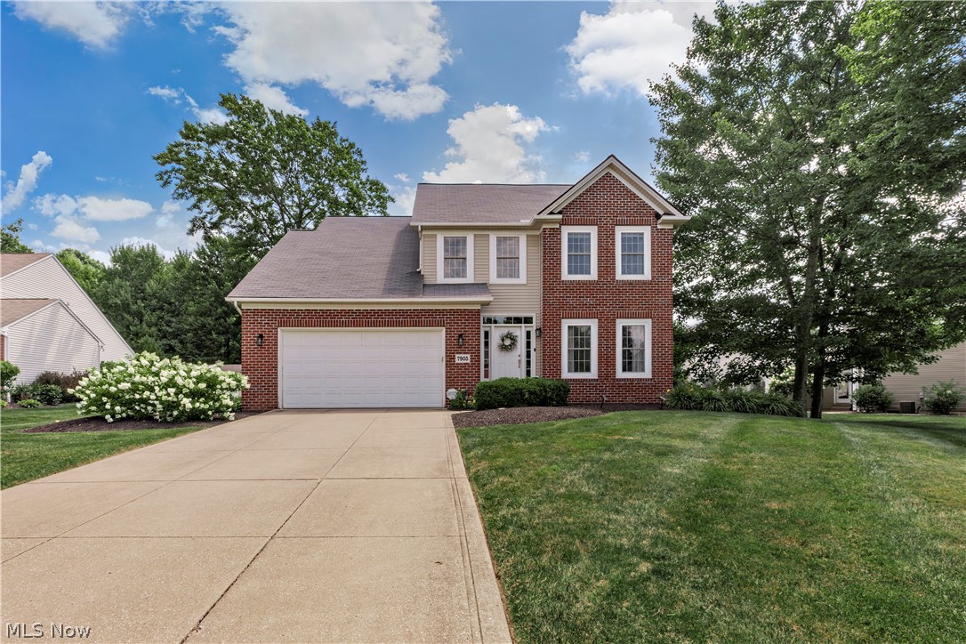 Welcome to this beautiful custom-built brick-front home is tucked away on a private cul-de-sac in desirable Ridgetop Estates, a welcoming community with neighborhood activities planned throughout the year. Enjoy scenic wooded views of the Township Community Park trails directly behind the property, offering exceptional privacy and natural beauty. Located in the highly sought-after Twinsburg School District and benefiting from no RITA tax, this home combines comfort, convenience, and value.

The gorgeous kitchen features a huge center island, granite countertops, double ovens, stainless steel appliances, and recessed lighting. The cathedral morning room provides beautiful wooded views and an abundance of natural light through a wall of windows. The great room features a cozy fireplace, while the large foyer and dining room showcase crown molding and beautiful hardwood floors throughout the first floor. A spacious laundry room with countertops and cabinets completes the main level.

The owner's suite includes a vaulted ceiling, walk-in closet, and dual-vanity bath. Three additional spacious bedrooms offer ample storage and closet space.

The finished lower level boasts a spacious floor plan with beautiful custom-built bookshelves, a bar area, and built-in surround sound speakers, creating the perfect setting for entertaining and everyday enjoyment. There is also an office or optional fifth bedroom with built-ins and a large full bath, providing excellent flexibility for guests, remote work, or multi-generational living.

Step outside to enjoy the beautiful stamped concrete patio overlooking the private wooded backyard and Township Community Park trails. Gorgeous flowering perennials and herbs planted throughout the landscape further enhance the home's charm and outdoor appeal.