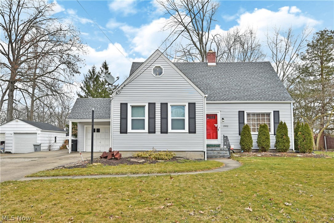 Welcome home to this charming 3 bedroom and 2 full bath home in a quiet neighborhood with an oversized back yard. The eat-in kitchen is completely updated with new cabinets, corian countertops and stainless steel appliances. The dining room has quaint built-ins and hardwood floors. The spacious living room also boasts hardwood floors with a wood burning fireplace, ideal for a cozy night. Perfect for all families with a first floor bedroom and full bath! The large back yard is partially fenced with posts already placed to finish it off!!! There is a covered walkway from the home to the garage and an extra parking space on the side. The partially finished basement provides for a second living space. Call today for your private showing!