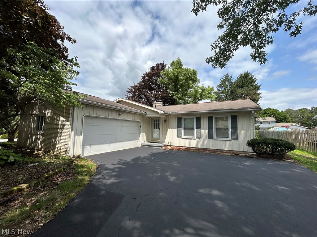 Welcome to this well-maintained ranch home nestled on a quiet cul-de-sac in Boardman. Designed for convenient first-floor living, this home features a functional layout with spacious living areas, a first-floor laundry room, a convenient half bath, and an attached garage for added everyday ease. The inviting family room is filled with fireplace and natural light and features a sliding glass door that opens to the backyard patio, creating the perfect space for indoor and outdoor entertaining. Enjoy relaxing, grilling, or dining outside while overlooking the peaceful backyard. The full basement provides abundant storage and offers endless possibilities for a workshop, home gym, recreation room, or future finished living space. Significant improvements have been implemented to the foundation with a 50 year guarantee. A whole-house generator adds valuable peace of mind by helping keep the home powered during unexpected outages. The freshly sealed driveway enhances the home's curb appeal while providing a clean, well-maintained appearance. This home offers both tranquility and everyday convenience. With its desirable ranch layout, practical amenities, and move-in-ready appeal, this Boardman home is ready to welcome its next owner.