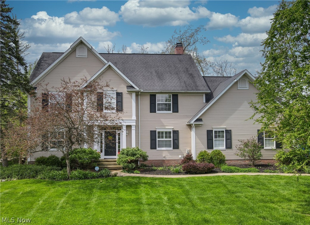 Beautiful custom-built home ideally located just minutes from downtown Hudson. Thoughtfully designed with spacious living areas and quality finishes throughout, this home offers both comfort and functionality. The main level features 9-foot ceilings, a formal living room and dining room, private first-floor office, half bath, and a separate laundry room. The beautifully appointed kitchen showcases custom cabinetry, granite countertops, a butcher block center island, and a large peninsula with seating—perfect for gathering and entertaining. Expansive windows overlook the large private backyard, filling the home with natural light. The inviting family room features a fireplace and doors leading to the expansive deck, with stairs down to the patio and backyard retreat. Upstairs, the spacious primary suite offers vaulted ceilings and a luxurious en suite bath complete with a large soaking tub, walk-in tiled shower, and custom double vanity with abundant storage. The oversized walk-in closet includes access to a convenient walk-in storage room. Three additional generously sized bedrooms offer excellent closet space, including one with a private bath and two connected by a Jack-and-Jill bathroom. The finished walk-out basement provides even more living space with abundant natural light, a private guest bedroom, and a recently added full bathroom—ideal for visitors, multi-generational living, or a private retreat.