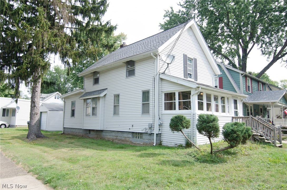 Perfectly located on a corner lot just minutes away from all of Falls' hot spots along the river front!  This home has beautifully refinished original hardwood floors in the living room and dining room. There is a wonderful built-in window bench with storage in the dining room too. The nice, clean kitchen comes with the range and refrigerator. The first floor bedroom is at the rear of the home and would also make a perfect office. Upstairs you will find two additional bedrooms and spacious bathroom. A claw foot tub and built-ins give this full bathroom tons of character. In the full basement you will find a washer and dryer that stay, updated electrical boxes, newer furnace, newer hot water tank, shower and great open space for storage. Enjoy the neighborhood from the back porch or enclosed front porch. New A/C unit and furnace in 2002, new roof 2012, hot water tank 2015, garage siding 2015. Take advantage of this amazing price, before it's gone! Call for your private showing today!