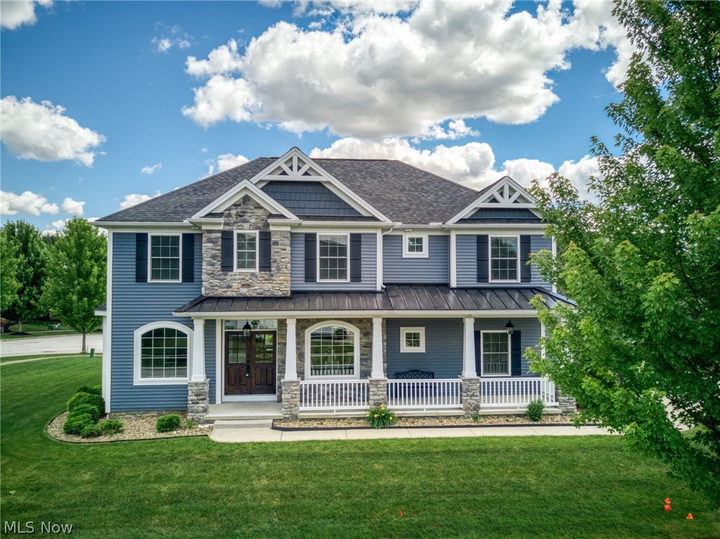 Welcome Home! Exceptional custom-designed Craftsman-style home in Woodland Estates, built in 2020 & offering 3,900 + sq. ft. of beautifully finished living space. 4 BR, 4.5 Bath residence combines luxury, comfort, & functionality in one of the area's most desirable locations. Inviting front porch & impressive double-door entry set the tone for the beautifully appointed interior featuring hardwood flooring & board-and-batten trim on the main level. Stunning, fully applianced, eat-in Kitchen is truly the heart of the home - featuring a massive 5' x 8' center island w/seating, 5' x 7' walk-in pantry w/coffee bar & freezer, plus a bayed dining area overlooks the private backyard. Entertaining is effortless w/adjacent Butler's Pantry featuring a beverage cooler, wine rack, & sink, located next to the Formal Dining Room. Spacious 2-Story Great Room boasts a gas fireplace & dramatic wall of windows that fill the home w/natural light. Private 1st floor Office provides the ideal work-from-home space, while the Mud Room & Powder Room offer everyday convenience. Upstairs, the vaulted Owner's Suite is a true retreat featuring double-door entry, luxurious ensuite bath w/dual vanities, freestanding soaking tub, oversized corner shower & huge walk-in closet w/skylight. Private Guest Suite offers its own full bath & walk-in closet, while BR's 3 & 4 share a bath w/dual vanities. The conveniently located 2nd floor Laundry Room includes W/D & utility sink. Phenomenal finished LL expands your living space w/an enormous entertainment area, spectacular wet bar w/refrigerator, exercise room w/cedar sauna, full bath, & plenty of storage. Outside, enjoy the private backyard featuring a paver patio w/built-in fire pit - perfect for gathering w/family & friends. 3-car side-entry garage. Meticulously maintained w/neutral decor throughout! Ideally located near award winning schools, Hudson Country Club, & w/quick access to I-480 & the Ohio Turnpike.