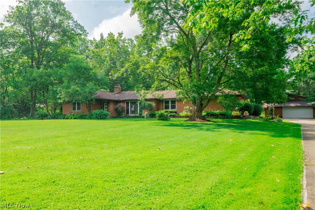Incredible opportunity to own a well-maintained ranch on over an acre on a quaint road. Spacious & inviting Living Room features stone surround wood burning fireplace. For additional space to entertain the large family room is perfect w/ wet bar, stone cinder rock accent wall & copper hood. Formal Dining Room has window that overlooks to the pretty front garden. Master Bedroom Suite carpeted w/ double closets ceiling fans & dressing room w/ cosmetic make-up desk. En-suite Bathroom has twin sink vanity, vaulted ceiling w/ skylight & step-in shower. Three additional sizable bedrooms all w/ double closets. Additional full & half Bathrooms. Convenient first floor laundry room w/ stacked washer & dryer. Great space for entertaining in the finished Lower Level Rec. Room w/ half bathroom. Outdoor living space creates the perfect space to entertain or just relax & take in the serene setting of your fenced backyard. 3 Car detached Garage w/work room off back. Updates include *2017 roof, 2017 we