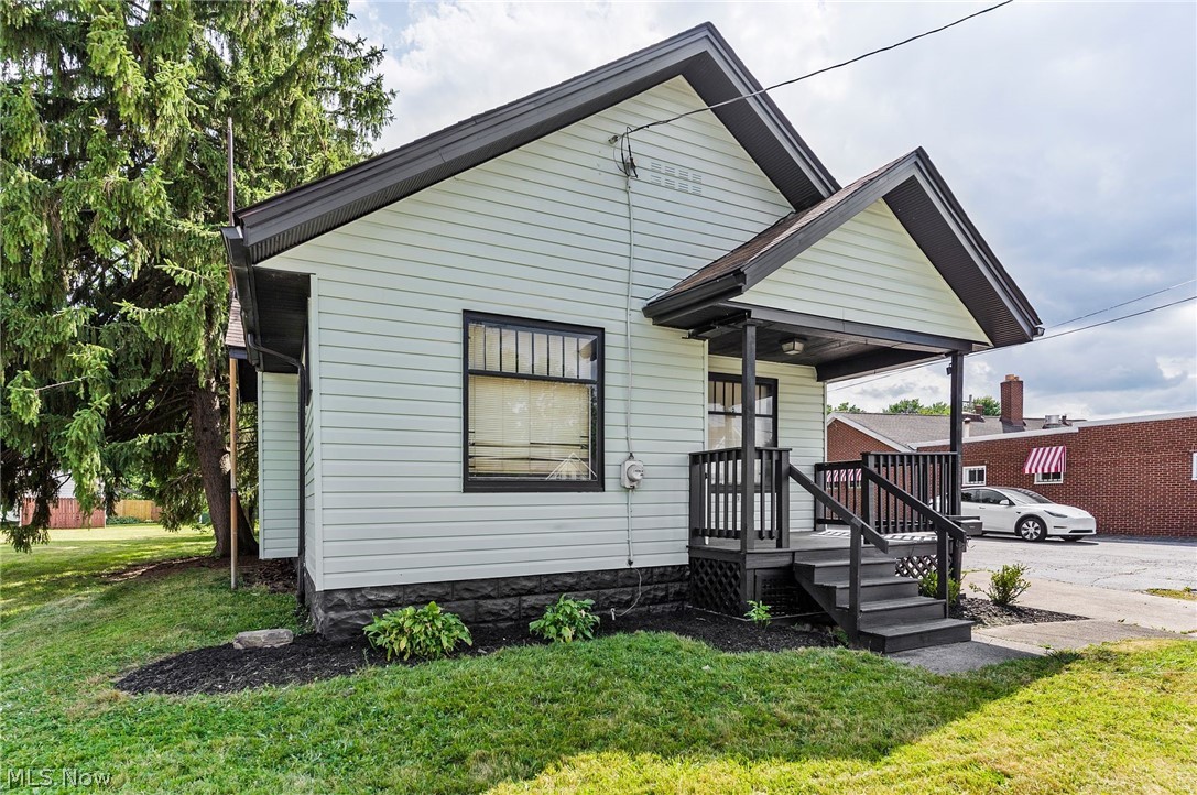 Charming and completely renovated 2 bedroom, 1 bath bungalow located on high-traffic Youngstown Road SE in Warren. This 800 sqft home has been thoughtfully updated throughout and is truly move-in ready.

Step inside to find fresh paint, new vinal flooring, and a bright, open feel. The updated kitchen features stylish green cabinetry, butcher block countertops, and modern fixtures. The bathroom has been refreshed with contemporary tile and finishes. A cozy fireplace anchors the living room, adding character and warmth.

Additional features include a full basement for storage or future finishing, a detached shed, and a welcoming front porch. The home sits on a small lot with easy access and excellent visibility.

This property has a proven rental history and offers strong income potential for investors. It is situated on commercially zoned land (buyer to verify zoning and any potential mixed-use opportunities with the City of Warren).

Whether you're looking for a low-maintenance owner-occupied home, a turnkey rental, or a property with commercial upside, this updated bungalow checks all the boxes. Convenient location with quick access to major routes.

Schedule your private showing today — this one won't last long!
