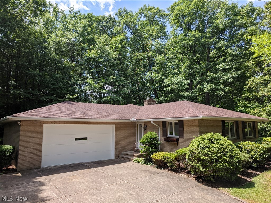 Custom designed brick ranch on 1+ acre secluded wooded lot.  This beautiful scenic location in popular Independence Ohio is minutes away from the best Cleveland has to offer in entertainment and shopping.  The quality home has over 1700 square feet of living area, highly efficient insulation in 6” exterior walls with R 19 value vs normal R 13, 3 season glassed in patio with outstanding wooded valley view,  new furnace and air conditioner,  new carpet in the living room, dining room, hallway, master bedroom, second bedroom and patio, completely repainted interior ceilings, walls and trim, fresh paint on all exterior doors and garage door, refreshed landscaping beds, new lighting in both bathrooms, 2.5 car garage with oversized ceiling height, finished basement section with custom bar and cabinets, kitchen dishwasher < 1 year old,  kitchen disposal < 2 years old, roof < 7 years old