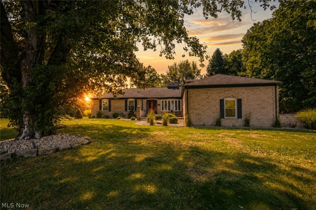 Set on nearly two private acres, this well-built brick ranch offers the space and versatility today's buyers are looking for. With only one prior owner, you'll find 2,220 square feet of comfortable living space, including 4 bedrooms and 3 full baths, plus a bonus room in the walk-out lower level, perfect for a man cave or additional entertaining area. There are 3 bedrooms on the main floor including an owners suite with its own private bath plus the 4th bedroom is tucked away in a spot all its own on a private second floor. This would be great for a guest room or office since it's steps away from a full bath, first floor laundry, and the garage entry. There's a front living room with a fireplace and an equally large dining room space at the back of the home with amazing views of the treed backyard. Cozy up by one of two fireplaces or head outside to enjoy the 14x30 in-ground pool, surrounded by a flagstone patio and stone walls that's perfect for relaxed summer nights and weekends. The covered porch sits right alongside, giving you a shaded spot to relax while keeping an eye on the pool and backyard. Plus, there is a front patio area to accommodate a swing or chairs to give you a different view of the property. Car enthusiasts and hobbyists will appreciate the 4-car garage setup with a convenient 2-car attached garage plus a separate 26x28 brick, 2-car detached garage, offering plenty of room for vehicles, tools, or storage. With its solid brick construction, generous acreage, and thoughtful outdoor living spaces, this home is a rare find. Schedule your showing today!