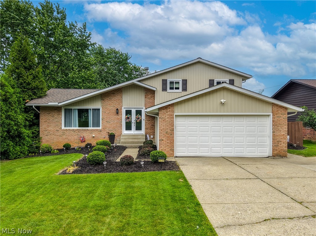 Gorgeous, move-in ready, fully updated split-level with a huge fully fenced backyard! The fence was freshly painted in 2025 and the backyard also features a large stone patio, perfect for entertaining, relaxing, or enjoying summer evenings. A large shed offers additional storage and features a newer roof (2018) and fresh paint (2025).
Step inside and you'll love the vaulted ceilings, open-concept layout, and beautiful hardwood floors throughout. The updated kitchen was remodeled in 2021 and features quartz countertops, ample cabinet space, and opens directly to the main living areas.

The main level offers two spacious living rooms, providing plenty of room for gatherings and everyday living. A fully remodeled full bathroom (2025) is conveniently located on the main level along with a flex room that makes a perfect home office, playroom, workout space, or guest area. Convenient main-floor laundry adds to the home's functionality and ease of living.

Upstairs you'll find 3 spacious bedrooms, including a primary bedroom with double closets. One bedroom features a new door and fresh paint completed in 2026.

The fully finished basement provides a large rec room with endless possibilities for additional living and entertaining space.

Additional updates include: Roof (2018), Furnace (2018), Front Door (2019), Siding & Gutters (2019), Sliding Glass Door (2017), A/C (2023), Garage Door Opener (2023), Hot Water Tank (2025), freshly painted 2-car garage (2025), and numerous cosmetic updates throughout.

This home has been exceptionally maintained and updated throughout. Just move in and enjoy!