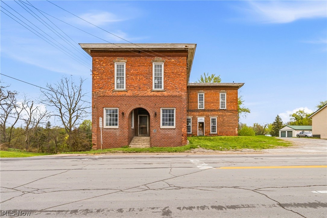 Welcome to the iconic “The Old Brick,” a rare opportunity to own a piece of history with prime commercial zoning in the heart of North Kingsville. Positioned at the high-visibility intersection of Route 193 and Route 20, this property offers exceptional exposure with 138 feet of frontage on Route 20 and 293 feet on Route 193, all set on a generous 0.8+ acre lot (35,719 SF). The site also includes 15 on-site parking spaces, adding convenience and value for customers, tenants, or future redevelopment.
Dating back to the 1860s, this historic building has served many purposes over the years, including a fire station, jail, hotel, and apartment building, making it a true local landmark filled with character you simply can’t recreate. Today, it presents a compelling opportunity for investors and entrepreneurs looking to bring new life to a high-traffic location.
Ideal for retail, restaurant, office space, antique shop, or mixed-use development, the layout offers flexibility to suit a variety of business concepts. Recent updates include new custom windows throughout, providing a solid starting point while leaving room to design and build out to your vision. With its combination of history, visibility, and potential, this property is ready for its next transformation.