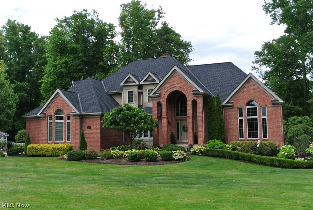 Move right into this fabulous all brick custom home with exceptional views of the 3rd green in Barringtons Gates Golf community. Exquisite craftsmanship & architectural details throughout. Grand open foyer with circular staircase. Grant open foyer with circular staircase. Elegant dining room with butlers pantry. Beautiful paneled library. Updated kitchen with white cabinets, granite counters, newer stainless appliances & glass tile back splash. Open to breakfast room & access to 3 season screened in porch. Cozy family room with fireplace surrounded by detailed wood shelving & breathtaking view. Grand Great Room. Romantic master suite on first with tray ceiling with updated glamour bath 2016. 2 staircases leading up to 3 generous bedrooms with large closets & en-suite baths. finished lower level boats of large wet bar with informal seating family room with electric fireplace, game room, exercise room. Home theater is excluded but negotiable. Enjoy the year round lifestyle that Barringto