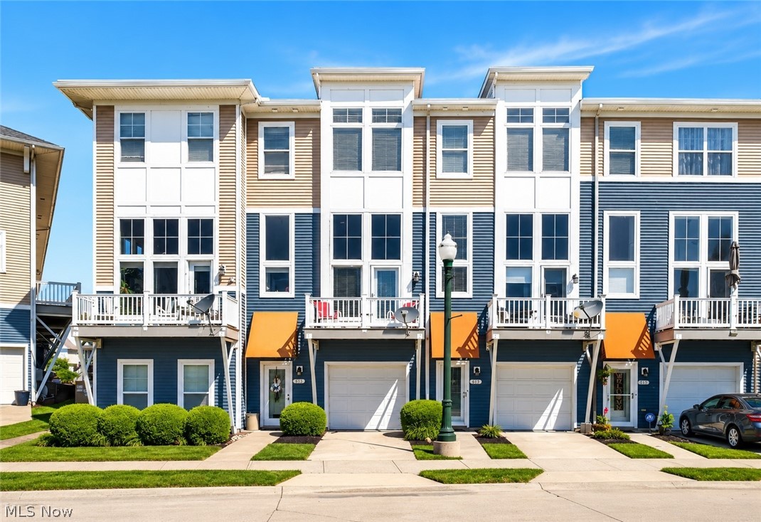 Welcome home to your fully furnished Waterfront Townhome with Black River Views & Private Dock Access! Nestled in one of Lorain's most sought-after waterfront communities, this beautifully maintained townhome offers stunning views of the Black River and Black River Landing. Featuring 2 bedrooms, 2 full baths, and 1 half bath, this spacious home is filled with natural light from soaring windows and dramatic ceilings. The inviting living room boasts a gas fireplace, two-story ceiling, and double doors leading to a waterfront deck perfect for relaxing while watching boats cruise by. Boat dock access is located directly out front, making this a dream property for boating enthusiasts. A rare opportunity! 

The second level features an eat-in kitchen with abundant counter space, a breakfast bar, all included appliances, a dining area, and double doors opening to a private rear deck ideal for entertaining or enjoying your morning coffee. The entire third floor is dedicated to the bedroom suites. The spacious primary suite offers a walk-in closet and luxurious ensuite bath complete with a soaking tub, glass-enclosed shower, and double vanity. A second bedroom and full bath provide comfortable accommodations for family or guests. Additional updates and features include two single-car garages (one front and one rear), new furnace, central air conditioning, hot water tank, touchscreen WiFi thermostat, professionally cleaned ductwork, two front windows replaced in 2024, and roof replaced in 2023. 

This home has always been smoke-free, pet-free, and has never been rented. Residents enjoy exceptional community amenities including a swimming pool, fitness center, and party room available for private events. Experience low-maintenance waterfront living with incredible views, modern updates, and easy access to downtown Lorain, Lake Erie, restaurants, marinas, and entertainment.