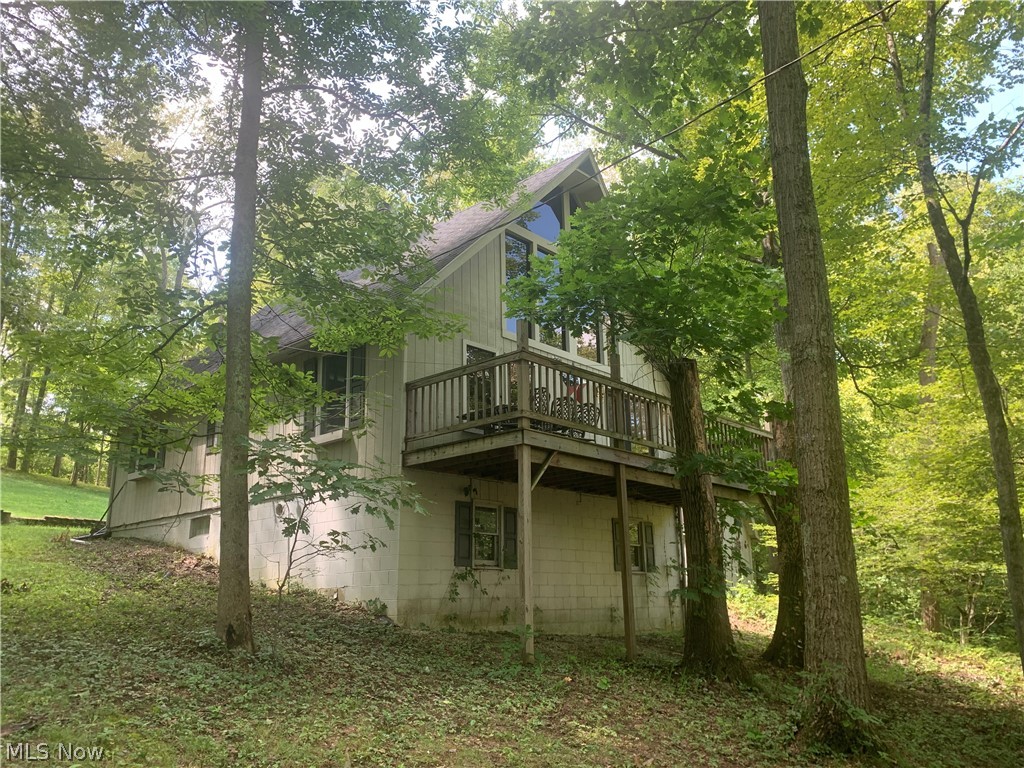 Charming Year-Round Home At Leesville Lake With Dock – 1+ Acres - Private Land – Fully Finished – Live & Online Bidding Available - ABSOLUTE AUCTION, all sells to the highest bidder on location: ONLINE AND LIVE ON-SITE BIDDING WILL BEGIN FRIDAY – SEPTEMBER 24, 2021 – 6:00 PM. Great 1.5 story home built in 1983 & located in Rockwood Park. Situated on 1+ acre open and wooded lots (8 lots, private land). Beautiful open concept kitchen and great room with cathedral wood ceilings, wood burner, and large windows. Front and rear decks with fantastic views. Updated full bath, first-floor bedroom, and loft bedroom. Full walk-out basement, FA gas furnace, washer/dryer, and newer hot water heater. Storage shed. The property comes with a dock. Close distance to a private beach, great fishing, and dock area. Fantastic getaway or year-round home! TERMS ON REAL ESTATE: 10% down auction day, balance due at closing. A 10% buyer’s premium will be added to the highest bid to establish the purchase price.