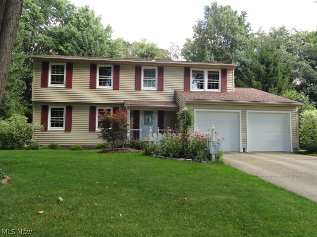 This pristine 4 bedroom 2.5 bath colonial in a desirable Stow neighborhood sits on a beautiful park like lot with brick patio, pergola and a large custom shed all overlooking a wooded area.  Maintained with perfection and tastefully remodeled through out.  Foyer entry to formal living and dining rooms.  Crown molding compliments the entire first floor.  The kitchen with new cabinets, appliances and quartz counters is redesigned with a built in window seat and island all open to the family room with skylight, fireplace, custom bookshelves and sliders to the patio. A half bath completes the first floor. Professionally  finished lower level rec room or office with built in storage and gas fireplace. Updates include: roof, siding many windows, furnace, AC, insulation, water heater, all bathrooms, and a Nature Stone garage floor. Short distance to Rt. 8 and shopping. Fabulous home!