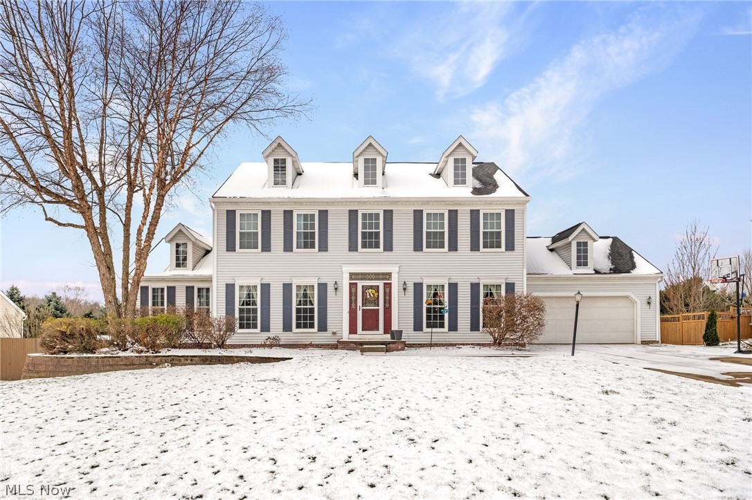 Beautiful listing at 3136 Helston Ave in the top-rated Green Local School District! Nestled in Hyde Park and just minutes from I-77, shopping, golf, parks, and dining, this Colonial-style home blends timeless charm with modern updates for a bright, flowing feel from room to room. A striking two-story façade invites you inside to a bright foyer with a traditional poplar staircase, neutral-toned treads, and a soft carpet runner guiding you up the steps. The family room impresses with vaulted ceilings, a custom brick wood-burning fireplace with a raised hearth and decorative mantel, and two full-glass French doors that open to the outdoors for easy entertaining and light-filled gatherings. The open kitchen showcases custom oak cabinetry, quartz countertops, and a bay window centered over the sink that bathes the space in natural light. The adjacent dining area features decorative painted wainscoting and floor-to-ceiling windows, creating a welcoming hub for everyday meals and special occasions. On the second level, the primary suite offers vaulted ceilings and a spa-like bathroom, complemented by three additional bedrooms with architectural drama from vaulted ceilings and a decorative tray wall. A refined home office with custom oak built-ins, wainscoting, and oak crown provides a polished workspace. The space also includes a dedicated first-floor laundry for everyday convenience. Step outside to a private backyard with a true brick chimney and a huge composite deck with a covered pergola—perfect for outdoor living and entertaining. Updates galore in this one and they include: dual-zone furnace, new roof, new windows, wide-plank luxury vinyl on the first floor, and a modern, low-maintenance composite deck and pergola. This home offers abundant light, generous room sizes, and smart storage throughout. Schedule your private showing to experience the flow, light, and details in person!