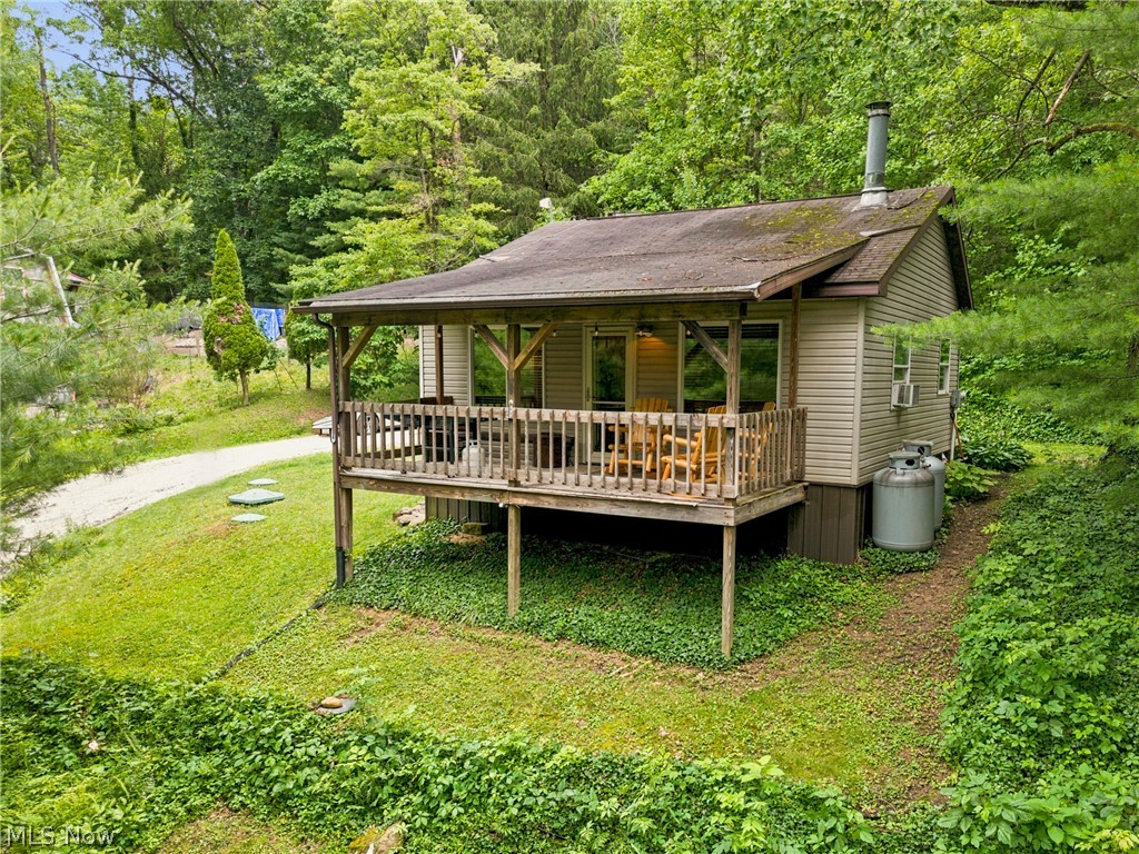 Whether you're searching for a personal lake retreat, a weekend escape, a vacation rental investment, or a turnkey hunting and fishing basecamp, this fully remodeled Leesville Lake getaway checks every box. This charming 1-bedroom home with a loft offers additional sleeping space, an inviting open-concept living area, a cozy wood-burning fireplace, and a spacious deck perfect for relaxing after a day on the water. Recent updates, including new flooring, windows, doors, lighting, appliances, and more (all completed in the last 5 years), make ownership effortless from day one. Outside, enjoy your private deck overlooking the community, secure a dock available at the marina for all your fishing needs, and take advantage of easy access to nearby Muskingum public hunting land just a short walk away. Located in the unrestricted Barnhouse Allotment with, which is an optional membership to owners, this property offers the flexibility to use as a private getaway, seasonal home, or income-producing short-term rental. With over 1,000 acres of renowned muskie fishing, boating, kayaking, and year-round outdoor recreation, Leesville Lake is one of Ohio's hidden gems for both relaxation and investment potential. A storage shed adds even more utility regardless of how you use it. Schedule your private tour today!