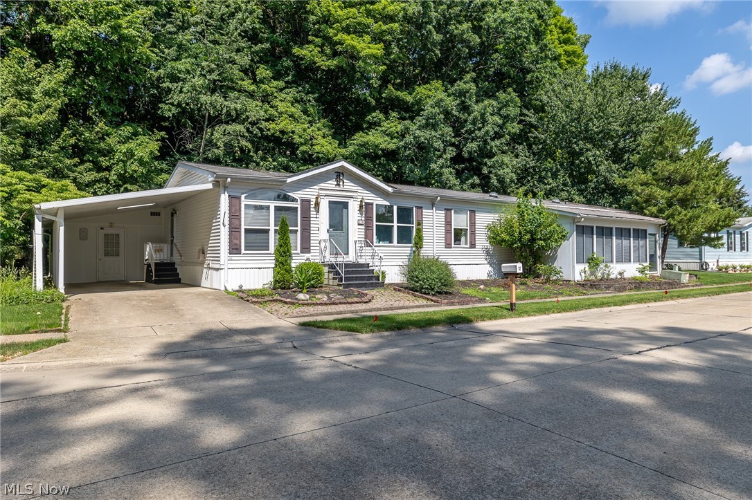COLUMBIA Park IS A 55 AND OLDER CONCEPT OF LIVING and is Ohio’s Premier Adult Land Lease Community! Amenities Include: Gated entrance! On site Shopping Plaza! On site Management! Walking Path/Dog Walking Path! Shuffleboard! Bocce Ball! Library! Crafts, and Social Hall!  WELCOME HOME to this 1994 Rochester Doublewide, DRYWALLED Manufactured Home offering 1950 sqft. (75x 26) featuring 3 Bedrooms, 2 Full Baths, Formal Living and Dining Room, Eat-in-Kitchen, Den, Laundry and a 4 Season Sunroom same level and a 3 Season Sunroom, step down.  There are also numerous skylights throughout the home. This house just keeps on going !!!!!!  The lot that it sets on is AWESOME, lots of green space, nature and privacy, and all of this on a Cul-de-sac!!!!!!!!!!!  Most ages are unknown however the HVAC System was replaced in March of 2025, Kitchen Counters are Granite, Primary Bath updated with a walk in shower.  Just bring your own personal decorating ideas and make this HOME SWEET HOME !!!!!!!!!!!!