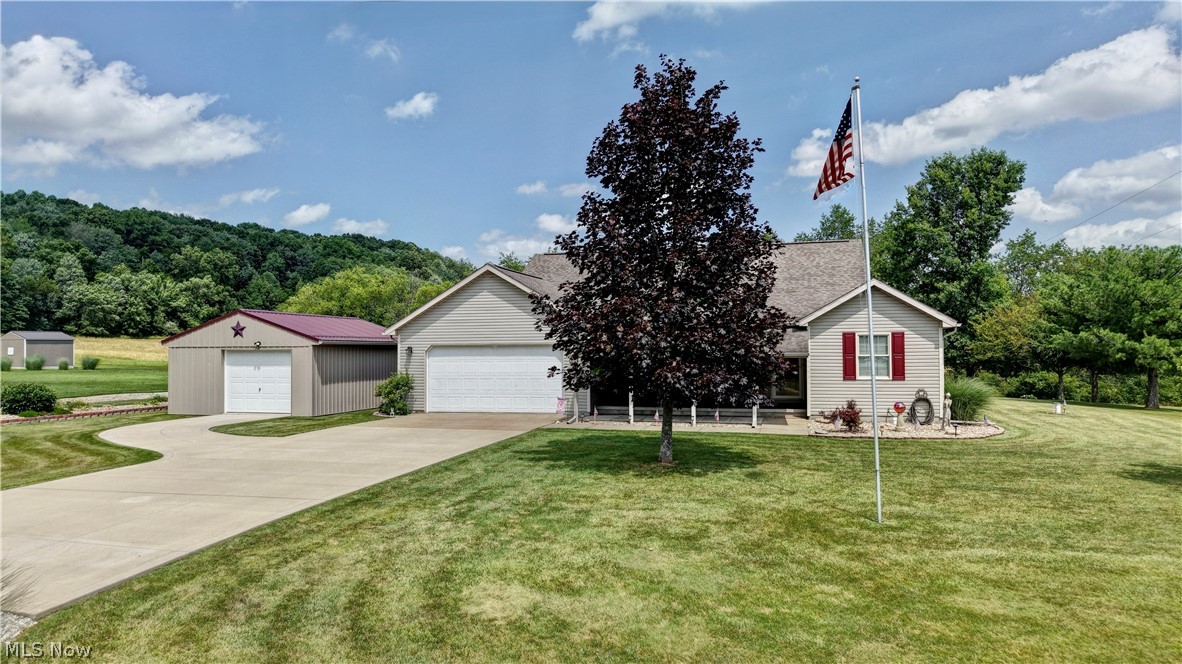 Move-in ready ranch offering one floor living with an abundant of extras & updates. Three full bedrooms on main level with a spacious full bath between two bedrooms. Primary suite w/ large full bathroom & huge walk-in closet. Main-floor office and convenient half bath. 20x20 Living room with gas fireplace and access to the back patio. Beautiful large kitchen w/ pantry, casual dining area, plus formal dining room adjacent . First-floor laundry w/ built-in shelving & cabinet. Walkout basement w/ possible 4th bedroom, full bath features a shower new in 2018, and kitchen area — ideal in-law suite or rental. Wood burner, newer furnace, & two generator systems. 2 car attached garage featuring an area w/ seasonal/plant storage, plus an additional detached garage. Detached Barn/Shed. Covered patio & a back patio. Newer attractive Smart core premium waterproof flooring thorough & many updated amenities throughout. 3 Types of heat, electric, wood burner, and propane. Lots of beautiful perennials and a space for a garden. Some portions of the back yard are fenced. Newer Furnace and air in 2017. New ventless propane water heater 2026.