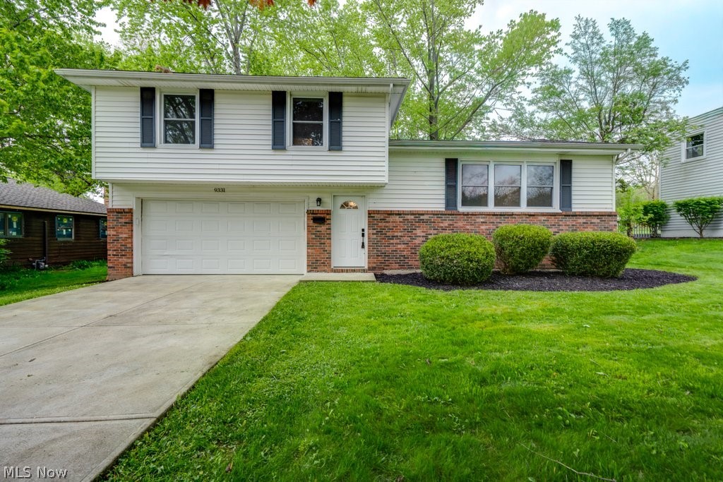WOW! Beautifully updated 3 bed/2 bath in Twinsburg!!  Upscale renovations include a gorgeous kitchen, granite counters, modern bathrooms, beautiful lighting, luxury flooring, vinyl siding & windows, and so much more! Bright, open floor plan. The front living room has a wall of windows and lots of natural light! The living room flows seamlessly into the dining area, which is open to the kitchen and family room addition. Sliders from the family room lead to a spacious deck overlooking the large, well-manicured lot - a perfect place for friends and family to gather. The finished rec room offers even more living space! Conveniently located near I-480, I-271, I-80. Just a short distance away from the Twinsburg Fitness Center and Water Park, public library, schools, parks, shopping, restaurants, and located in the highly rated Twinsburg School District. Call today!