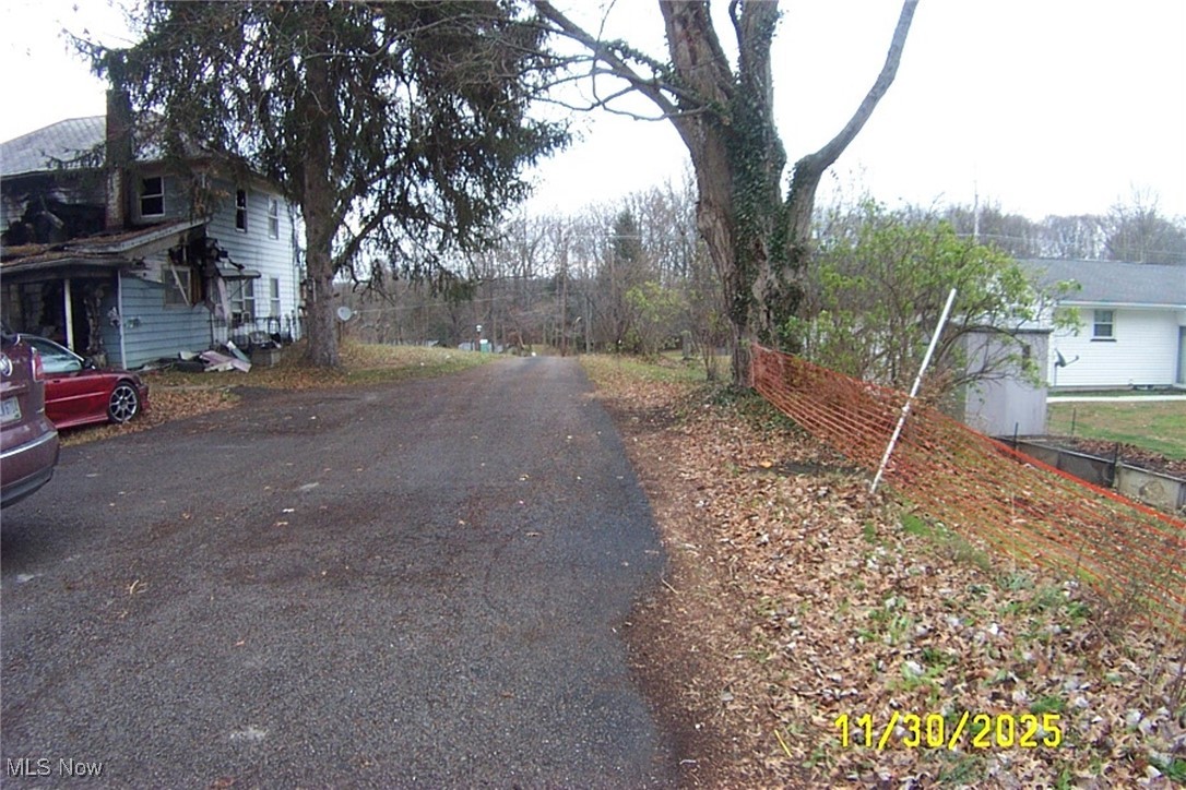 Looking for a building lot? Here is a 1.23 acres lot you should consider. Property already has a Garage/Barn, berry bushes, fruit trees, pasture, paved drive and there was electric, well and septic on the property. There is a century home on the lot that caught fire. The house had over 2500 sq ft of living space, 4 bedrooms. Kitchen area was totally burned and there is some damage to other areas of the home. Someone with time, funds and rehab abilities may be able to rehab the house. The possibilities to make this a great one family home again are limited only to potential buyers imagination and abilities. Land would also make a good building site with many of the necessities available (well and septic is there from the home, electric is available. Driveway is there as well as out-building and pasture. If this property looks like a good fit for you, give me or your Realtor a call and set up an appointment to view the land (home viewed exclusively from outside as fire department states no entry into the house) Any and all inspections or tests are solely at the expense of the buyer. Sizes and data believed to be true, however it is the responsibility of the buyer and their real estate agent to verify all facts.