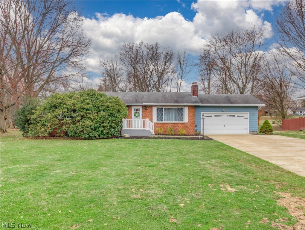 This charming ranch has been cherished & maintained in excellence by the same family for over 50 years. Great curb appeal in an established Tallmadge neighborhood of lovely homes situated on large lots. Extra wide concrete driveway. The new front deck porch steps into a foyer entry. Cozy formal living room with gas fireplace & picture window filling the room with natural light. Hardwood floors in most rooms under the carpet. Kitchen opens to the dining area with sliders to a 3 seasons sun room overlooking the large flat  sunny backyard with a patio and 8 x 10 shed. All bedrooms have ceiling fans and double closets. Main bath with large vanity and walk in shower. Attached garage with nature stone floor. Plenty of options in the lower level with a  rec room, private office, workshop room, laundry room plus storage room. New windows & refrigerator in 2020. New HVAC in '17 & new garage door & opener in '10. Home Warranty included. This home is beautiful, clean and bright throughout!