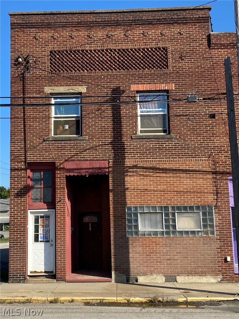 Real estate and business on corner lot. 2 story brick building with parking lot included. Operating since 1946 as Hanic's Cafe. Operating bar on the first floor. No kitchen in the bar, but have a food license. 2 1 BR apartments on 2nd story. Need work. Roof repair summer 2024. Brick exterior painted summer 2024. Bar flooring replaced 2022. Key card system installed 2025. New electrical panel installed upstairs 2025. 3 beer coolers and 3 standing refrigerators. Sale includes all furniture, fixtures, equipment and D2,D2X, and D3 Liquor Licenses. License and insurance are paid until October 2026. Additional profit of $18,650 in 2025 from sales of Ohio Lottery (including Keno), pull tabs, ATM, jukebox, and bowling.  MPG games; call owner for details. Alcohol sales $110,000 annually. Open at noon and close by 10pm. License allows to be open until 1:30am. Family run, no employees.