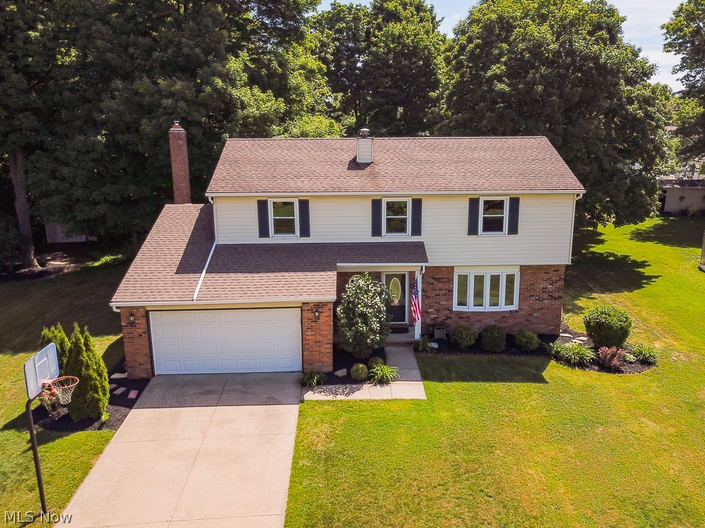 Fully Renovated Colonial in Mentor!  Kitchen fully renovated with new upscale cabinetry, new appliances, ceramic tile flooring, and granite countertops!  New flooring throughout. Fireplace was fully renovated with a new wood burning insert, new mantel and tile. Bathrooms have been renovated, basement finished in 2018 with expanded living space, carpet, drywall and glass block windows.  Don't miss the outdoor oasis!  Beautiful patio was put in 2017, outdoor lighting, new landscaping, and fire pit area are all amazing places to entertain and relax.  All major replacement were recently made as well. Furnace (2016), Hot water tank (2016),  AC (2018). Move right into this updated, well-maintain and worry-free home!