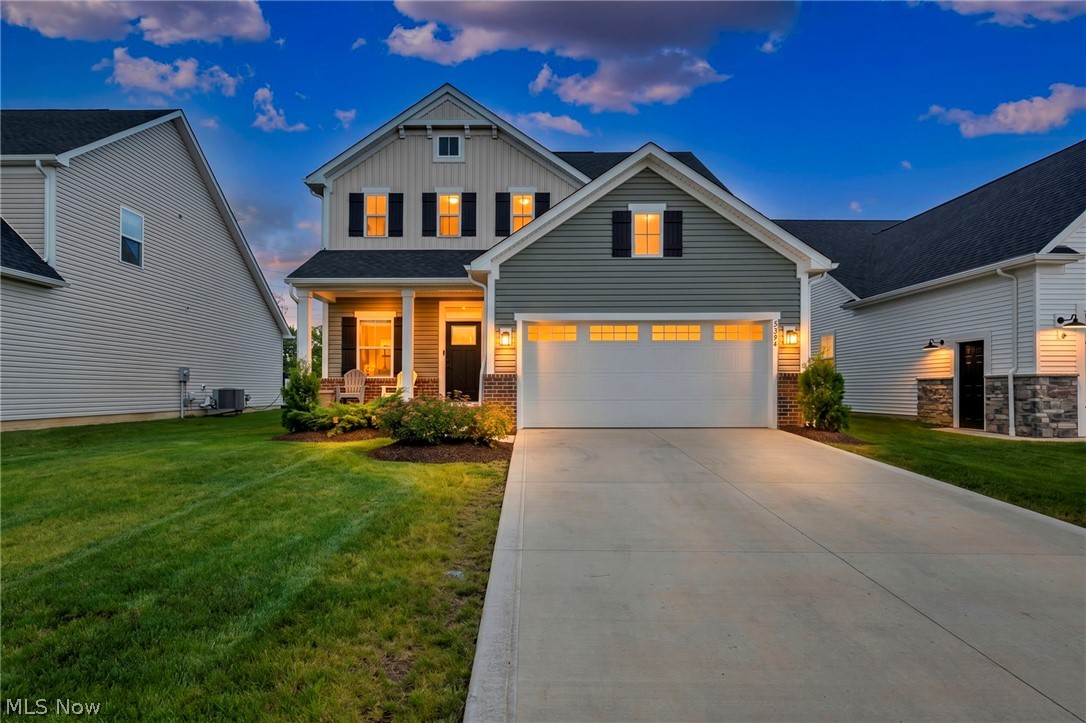 Almost new & loaded w/upgrades, highly sought-after floor plan is situated on a premium waterfront lot in the desirable Drees-built (low maintenance) Preserve at French Creek community. Enjoy peaceful lake views w/no rear neighbors, premium elevation w/partial brick front, relaxing covered front porch plus added covered rear deck overlooking serene water setting. Designed for today's lifestyle, exceptional home features 9-foot first-floor ceilings, abundant windows, upgraded LED lighting plus bright, open floor plan filled w/natural light. Stunning gourmet kitchen is sure to impress w/granite countertops, upgraded 42-inch cabinetry, custom tile backsplash, coffee station, large pantry and a massive chef's island w/breakfast bar perfect for gathering & entertaining. Kitchen flows seamlessly into the spacious great room, creating the ideal entertaining space & featuring a cozy fireplace for added warmth & ambiance. First-floor flex room currently serves as a home office & offers endless possibilities. Welcoming foyer is enhanced by a transom window & elegant design details throughout. Retreat to the luxurious owner's suite featuring beautiful water views, custom-tiled bath w/oversized walk-in shower, dual shower heads & built-in seat, plus dual walk-in closets. Upstairs you'll also find versatile loft area perfect for a media room, playroom or second living space, along w/convenience of 2nd floor laundry. Finished basement expands your living space even further w/large recreation area, full bath & endless possibilities for entertaining, fitness, guest accommodations. Located in one of Sheffield Village's most desirable communities, residents enjoy low-maintenance lifestyle w/optional recreation membership providing access to a fitness center/pool. Situated near shopping, dining & major highways, location offers both tranquility and accessibility. Rare opportunity to own a premium waterfront home loaded w/upgrades in area's most desirable neighborhoods!